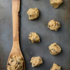 Baking sheet of chocolate chip cookie dough balls