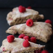 Raspberry scones on a black background.