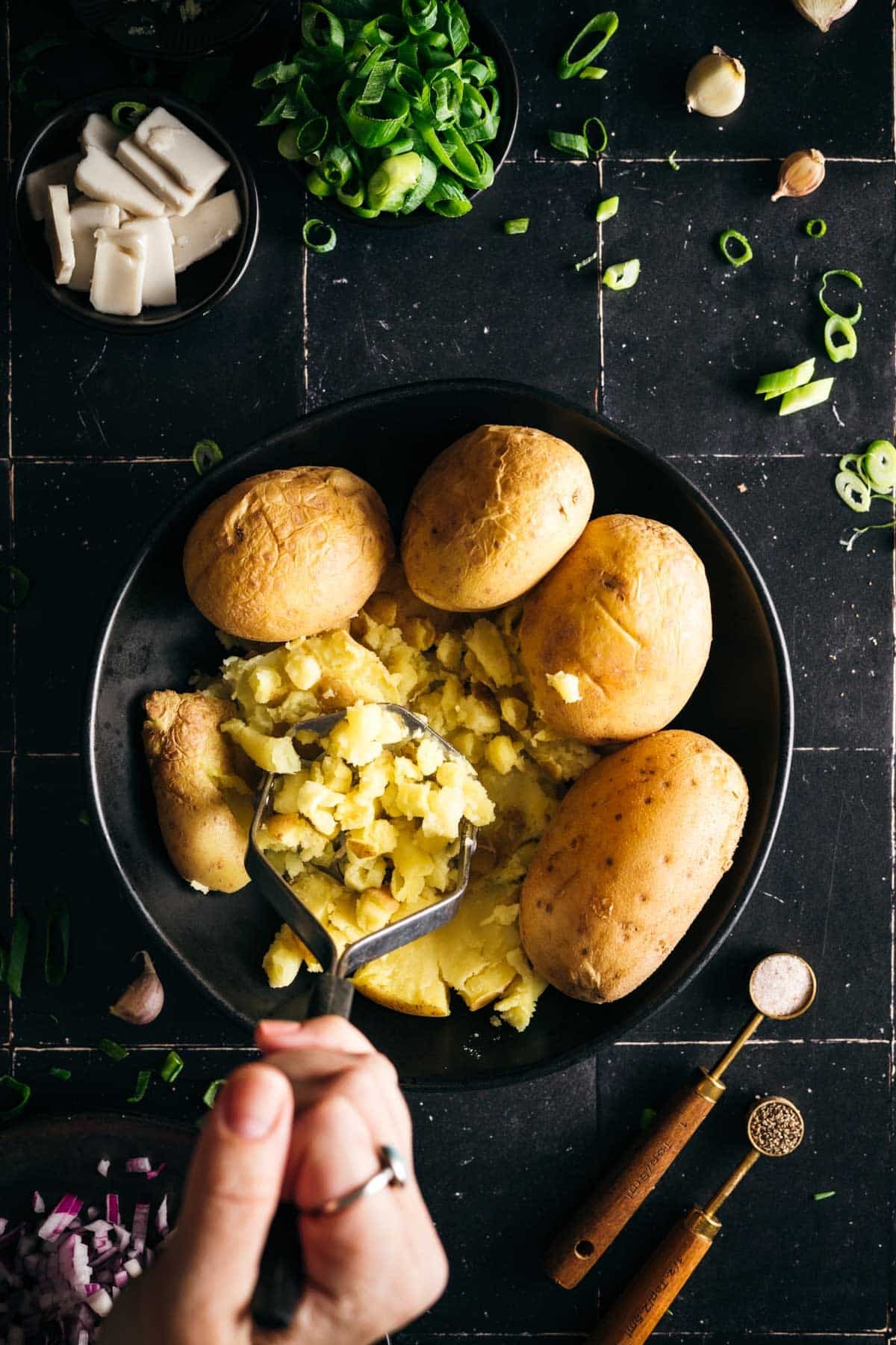 Mashed the cooked potatoes in a shallow bowl.
