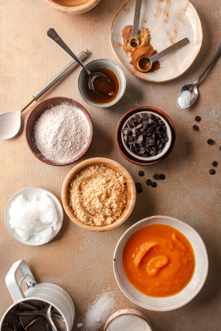 Small bowls of ingredients for pumpkin cookies.