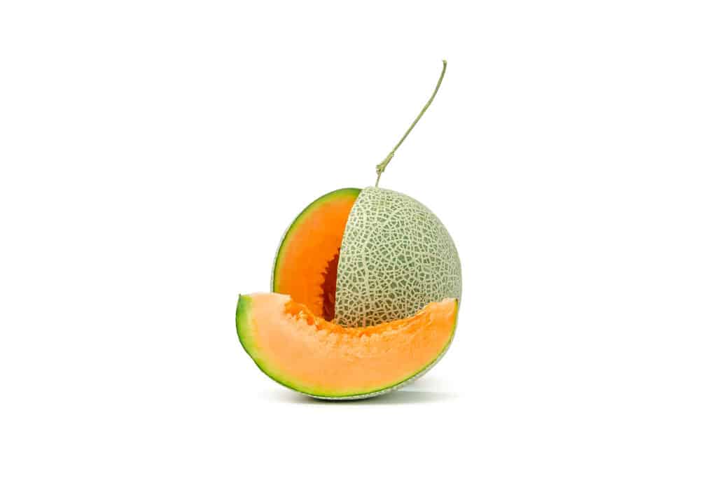 One large cantaloupe with slice cut out.