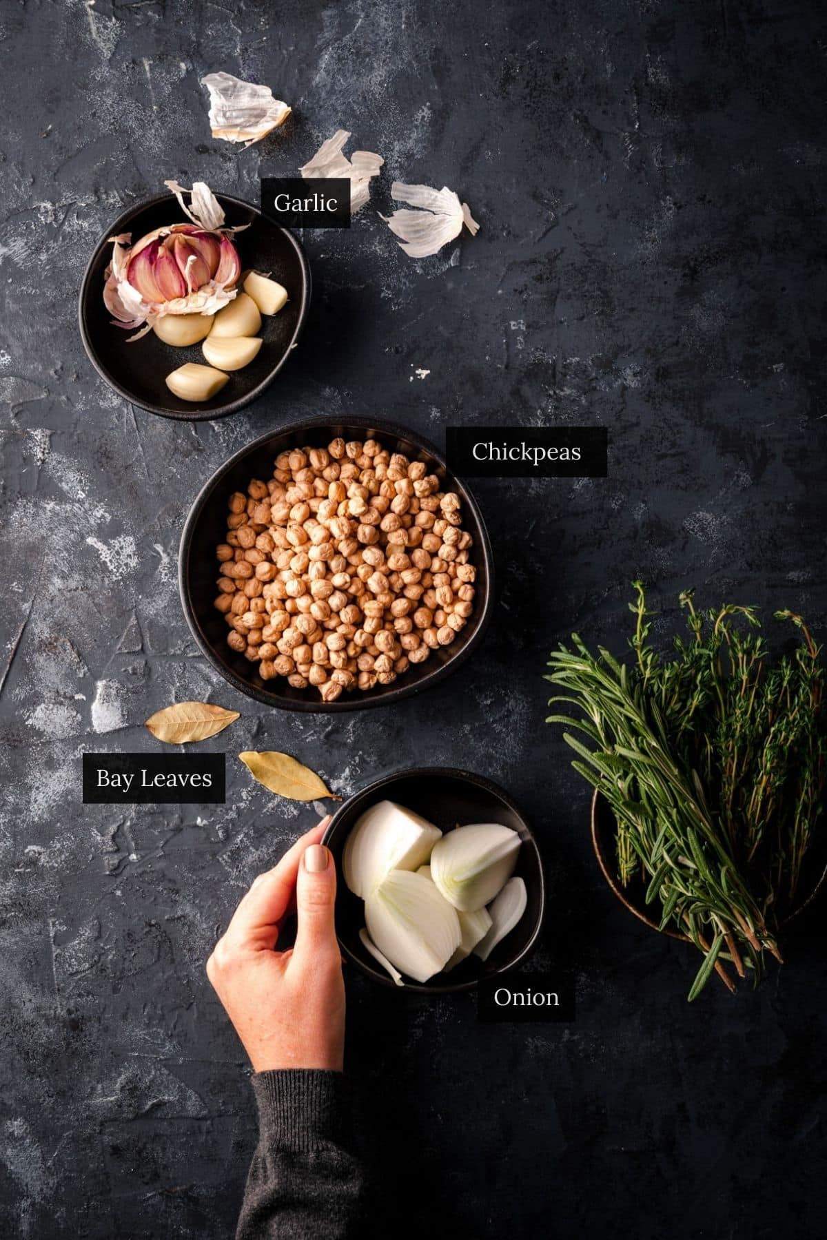 Chickpeas and aromatics for cooking garbanzo beans.