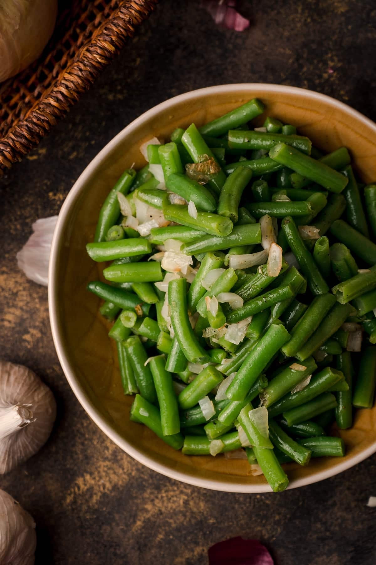 Golden yellow bowl of freshly cooked canned green beans.