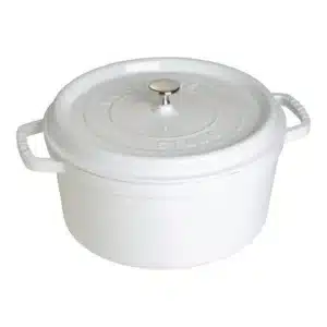A white cast iron Dutch oven with a lid.