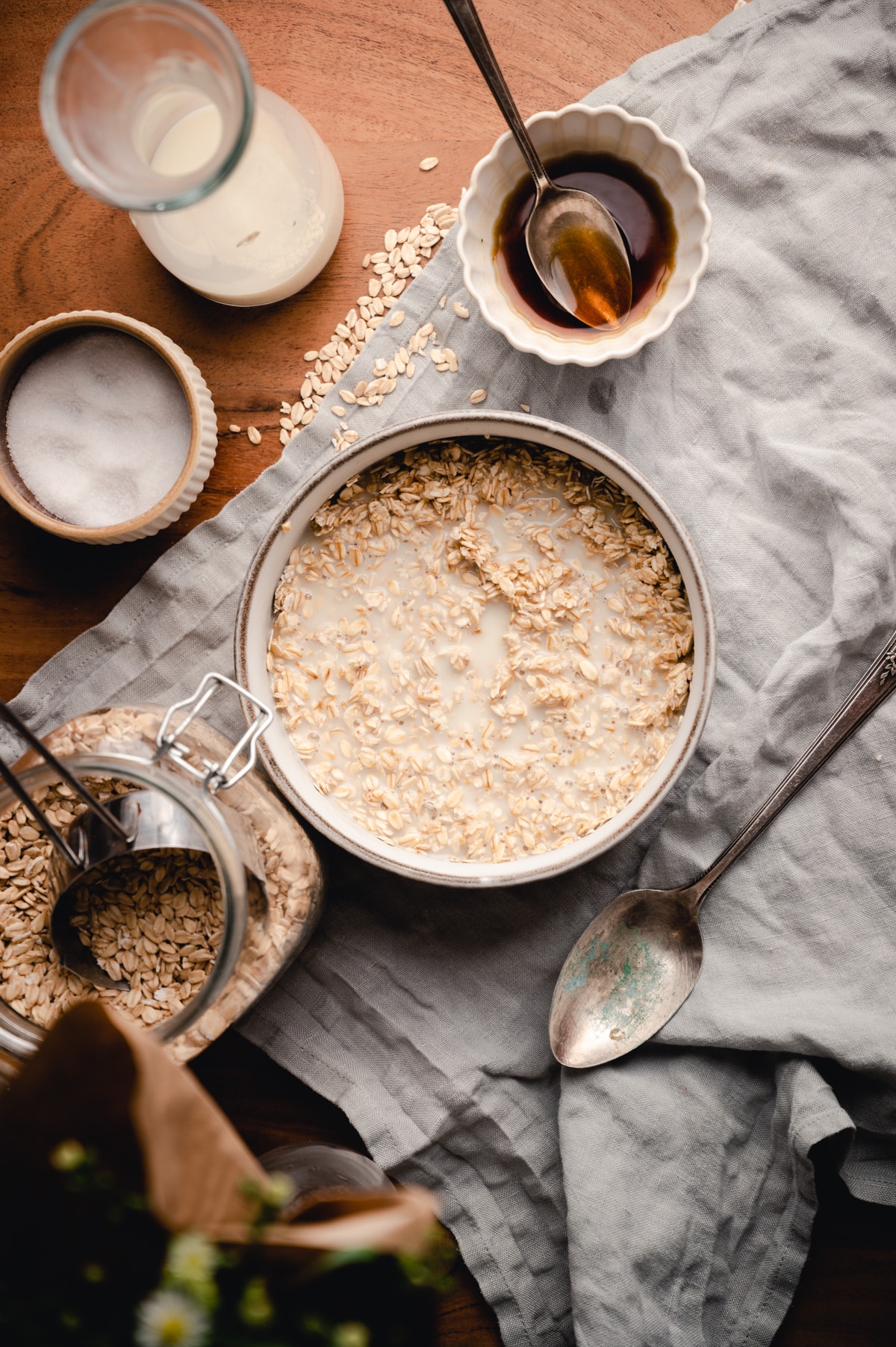 Bowl of rolled oats with hot oat milk poured on top.