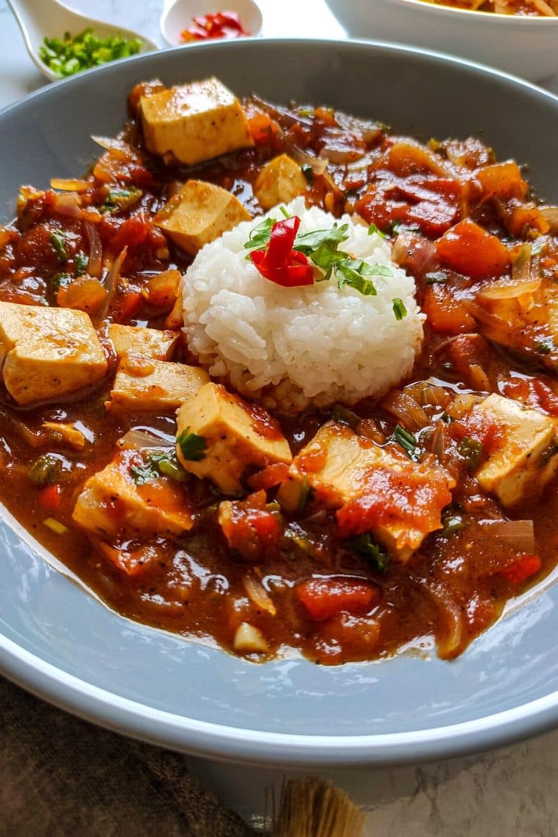Vegan tofu dish served with rice.