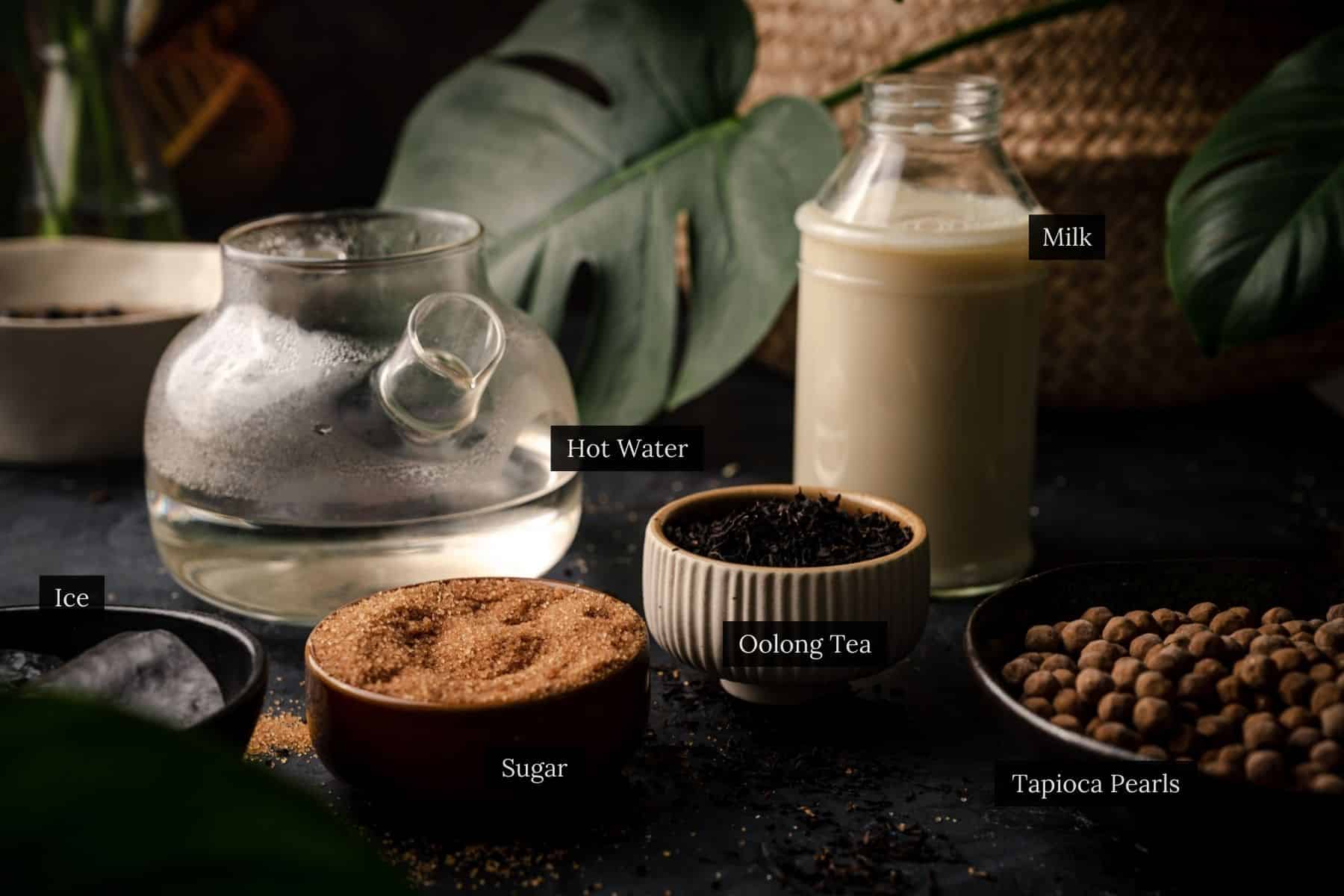 Ingredients for homemade oolong boba tea labeled.