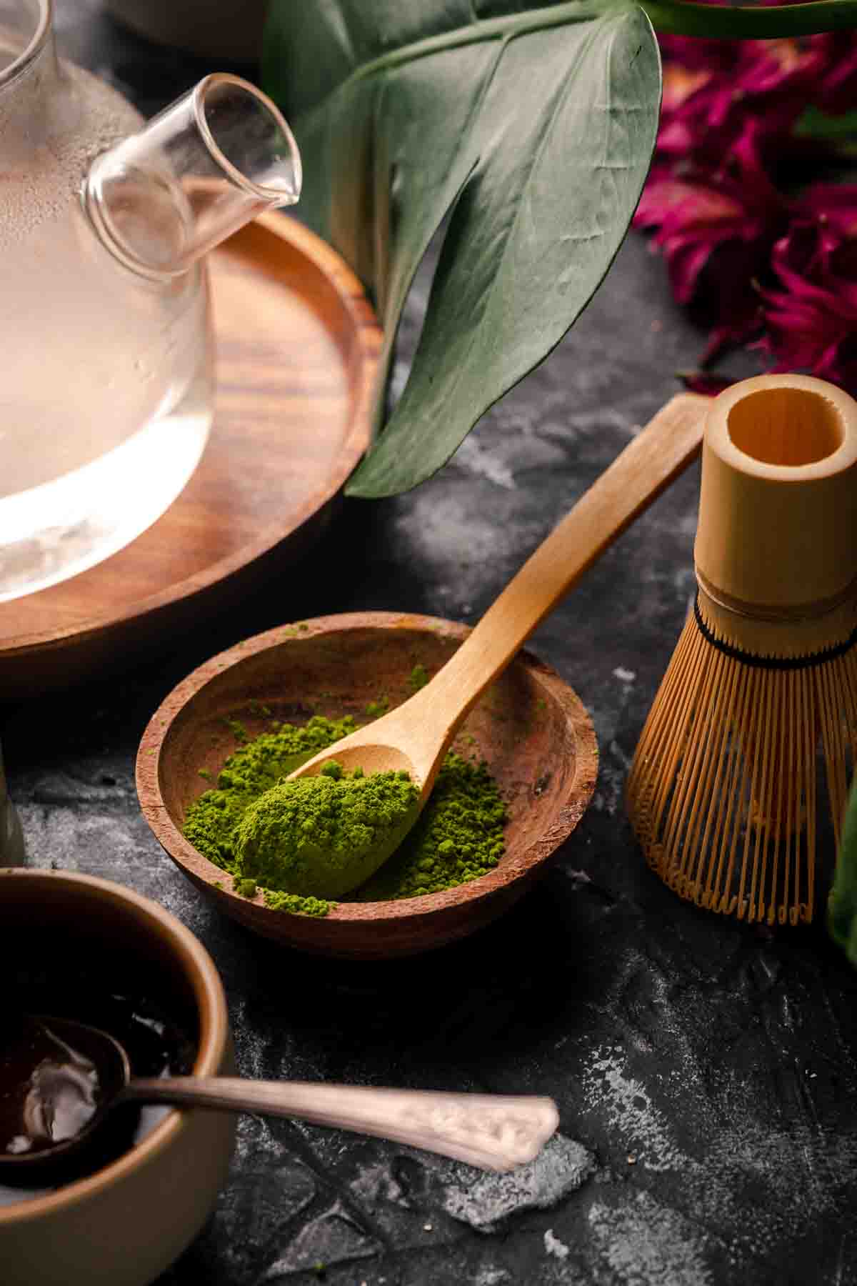 Wooden bowl filled with ceremonial grade Jade Leaf matcha.