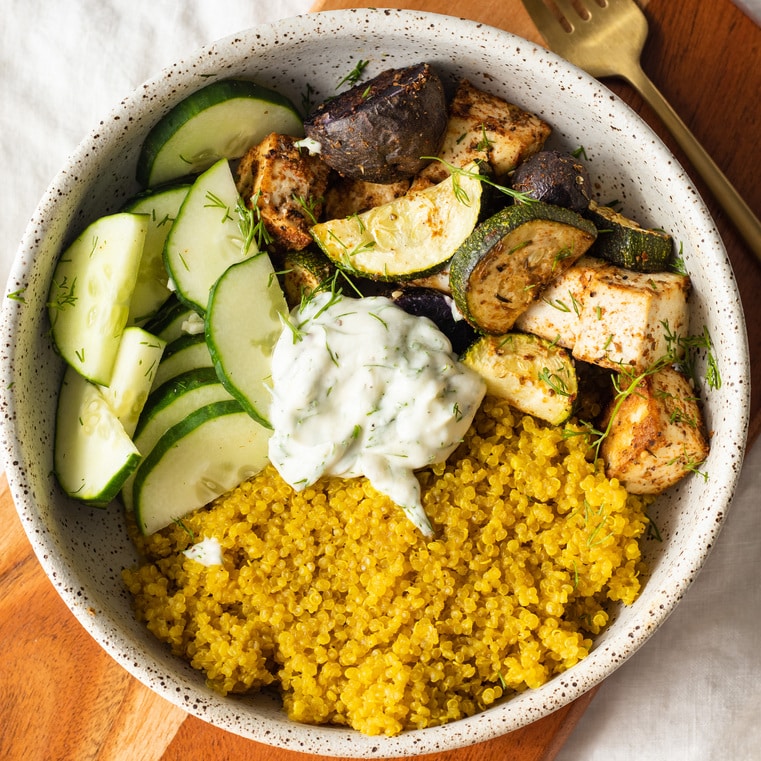 A vegan bowl filled with vegetables and tofu.