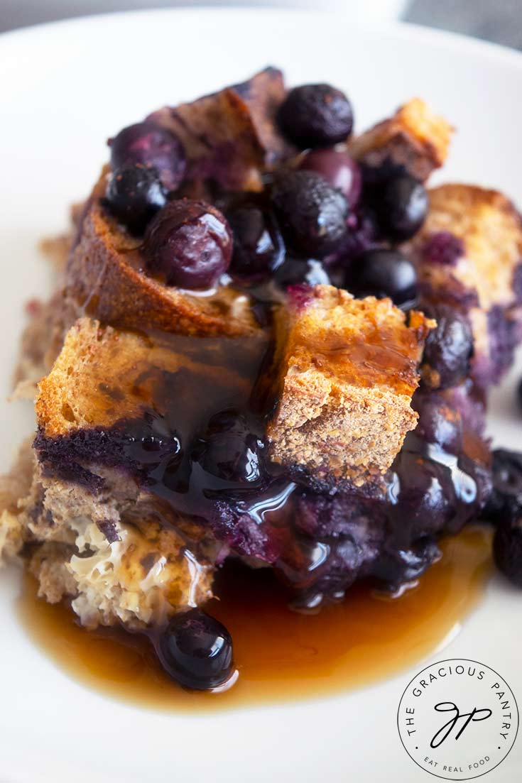 A plate of blueberry french toast topped with syrup.