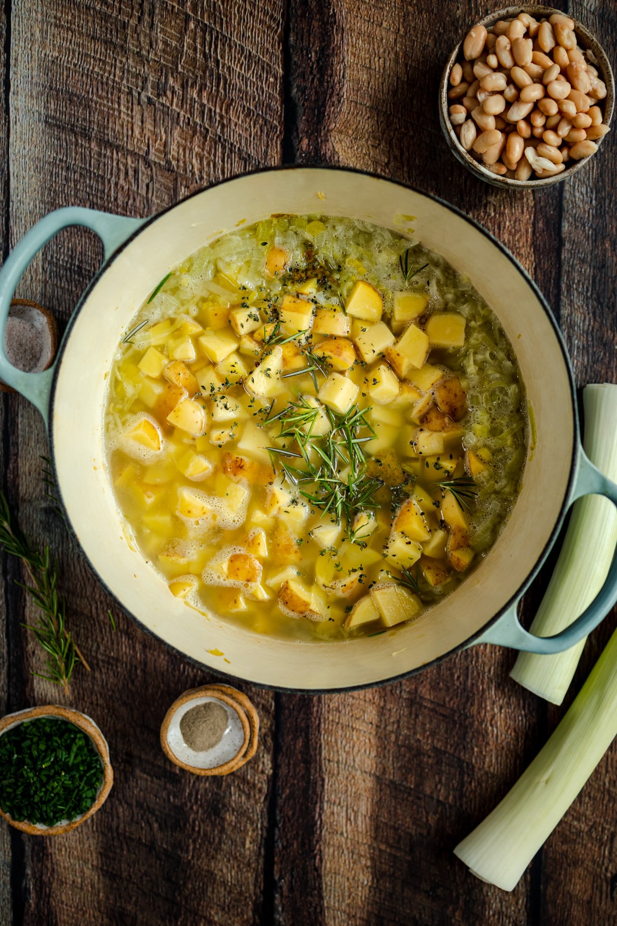 Added potatoes and herbs to potato soup.