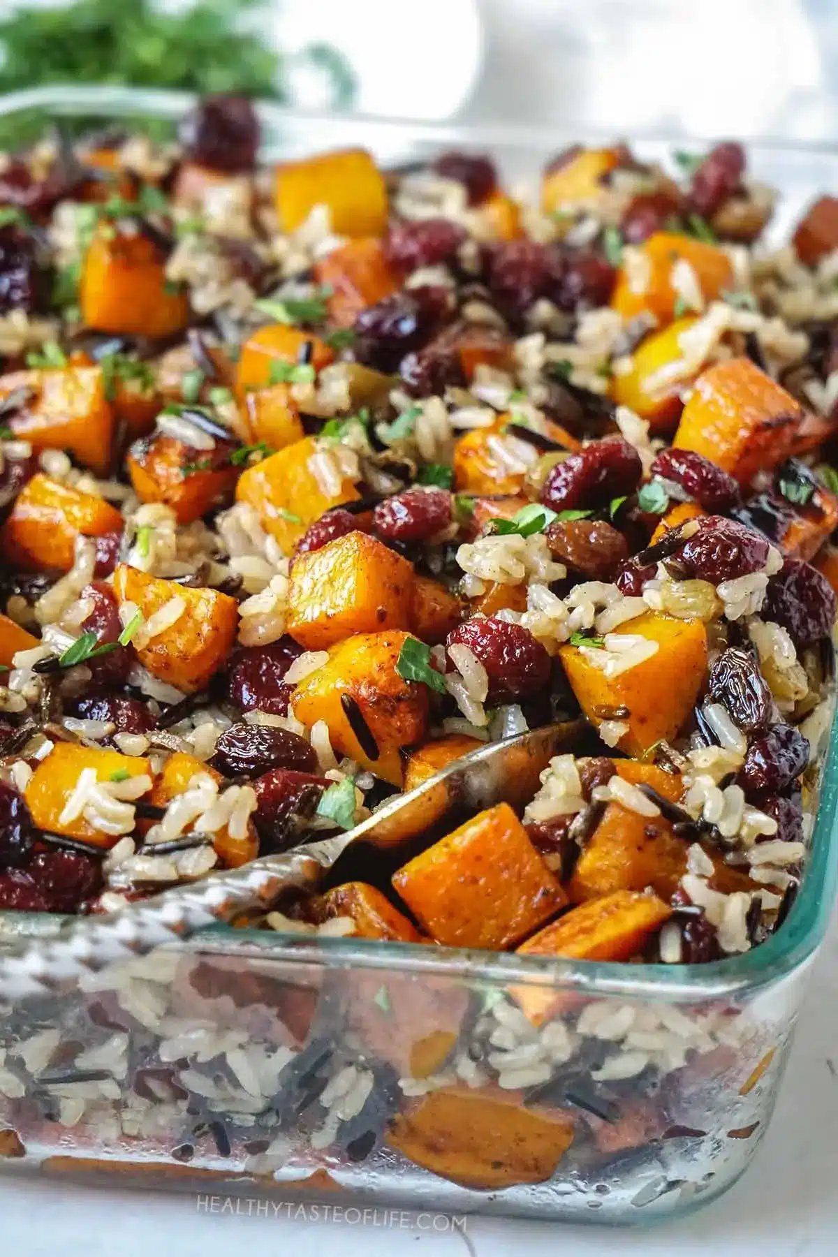 A vegan casserole featuring roasted butternut squash, brown and wild rice.