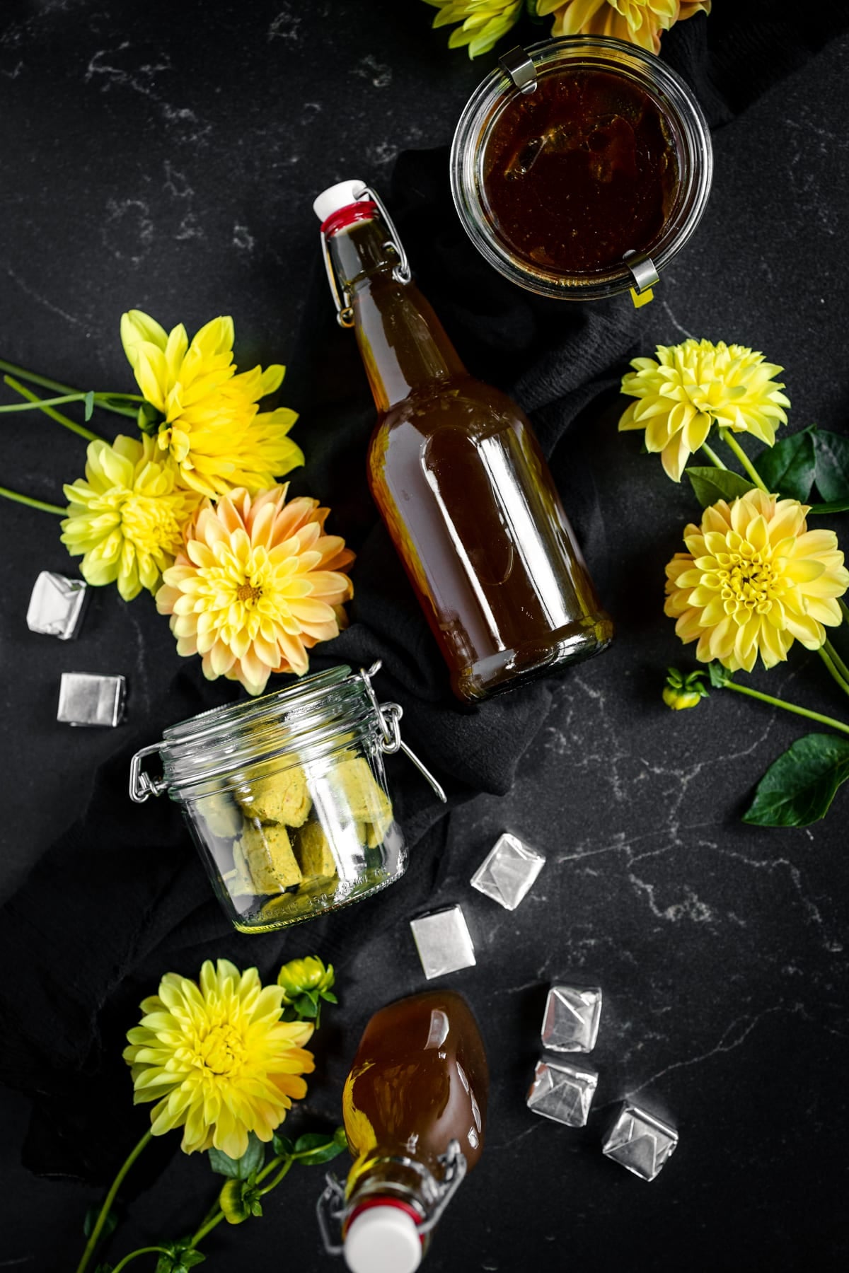 Vegetable bouillon cubes and broth on soapstone counter.