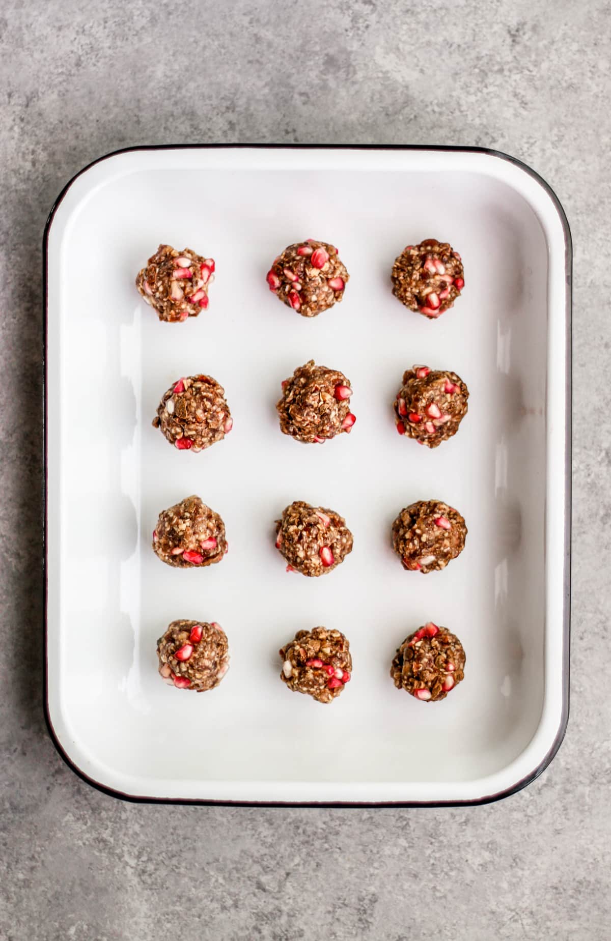 Enamel tray of pomegranate oatmeal balls.