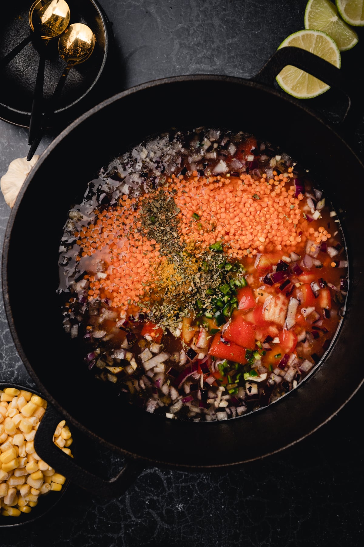 Lentils and herbs added to the homemade vegan chili pot.