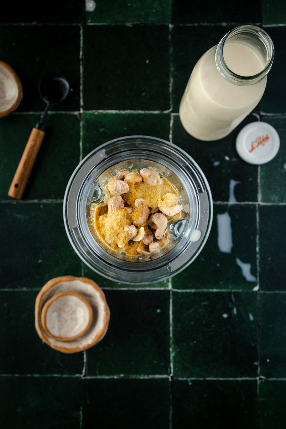 Ingredients for cashew ricotta cheese in a Vitamix blender cup.