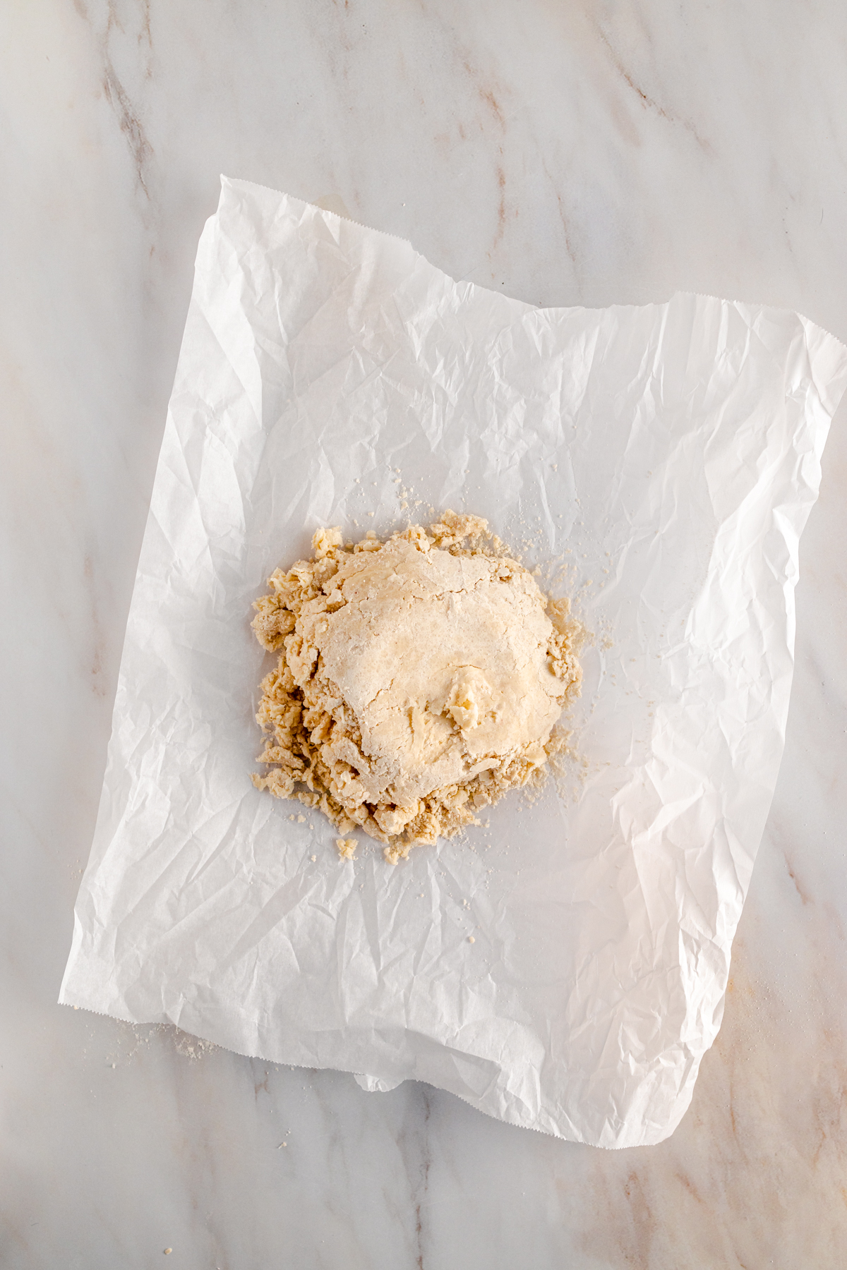 A piece of dough on a piece of paper.