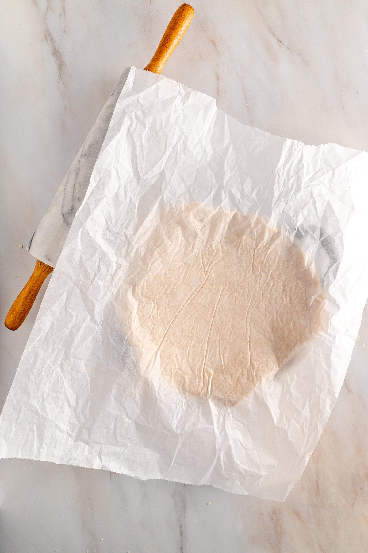 A piece of dough on a piece of paper.