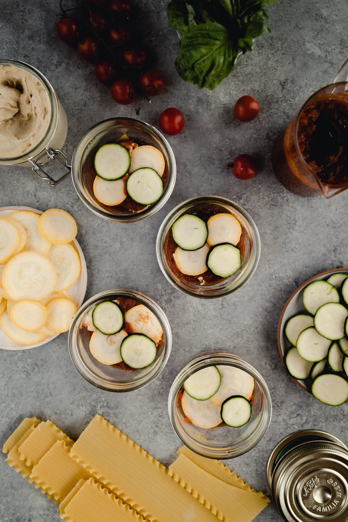 Step-by-step-photo of homemade mini lasagna made in a jar.