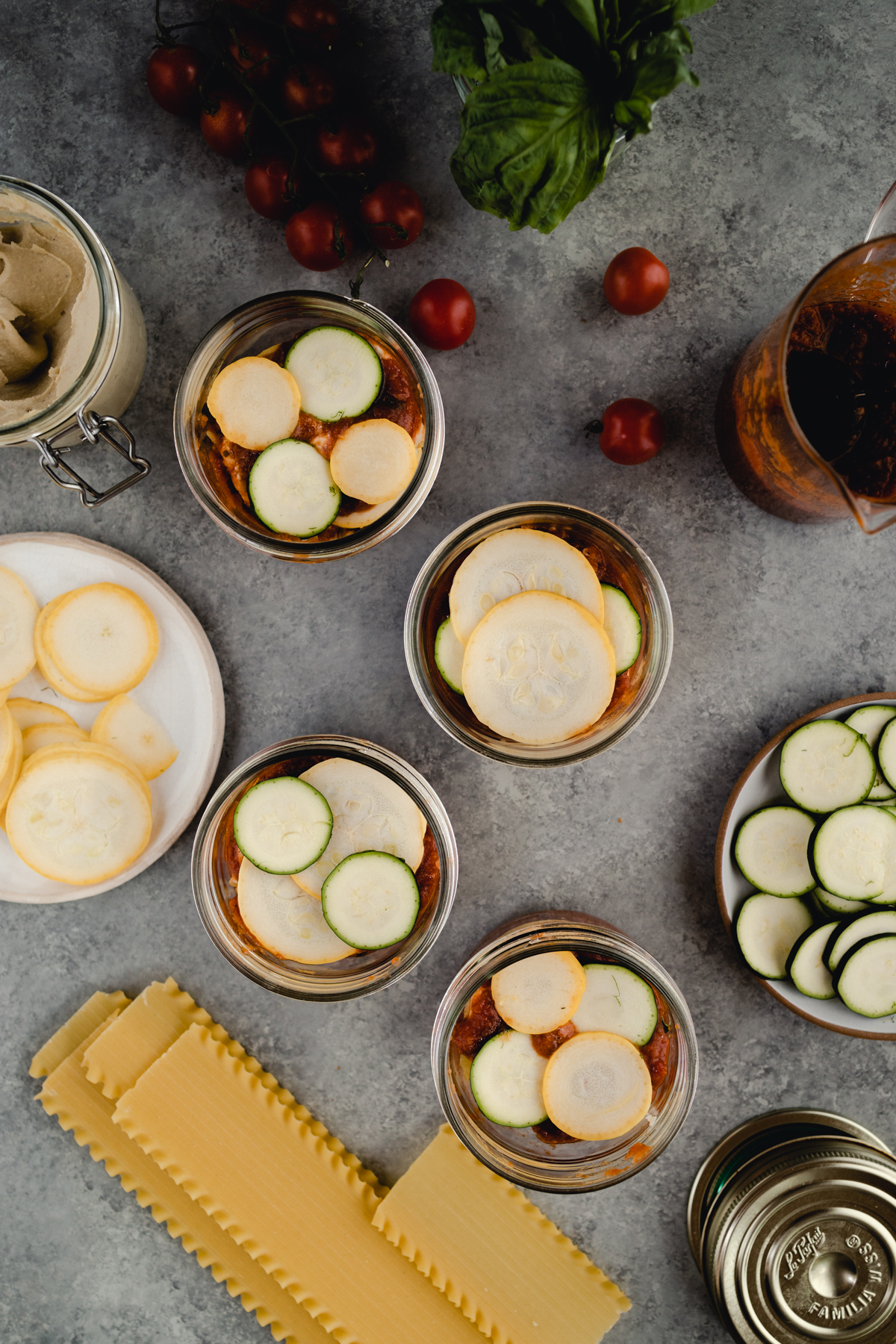 Step-by-step-photo of homemade mini lasagna made in a jar.
