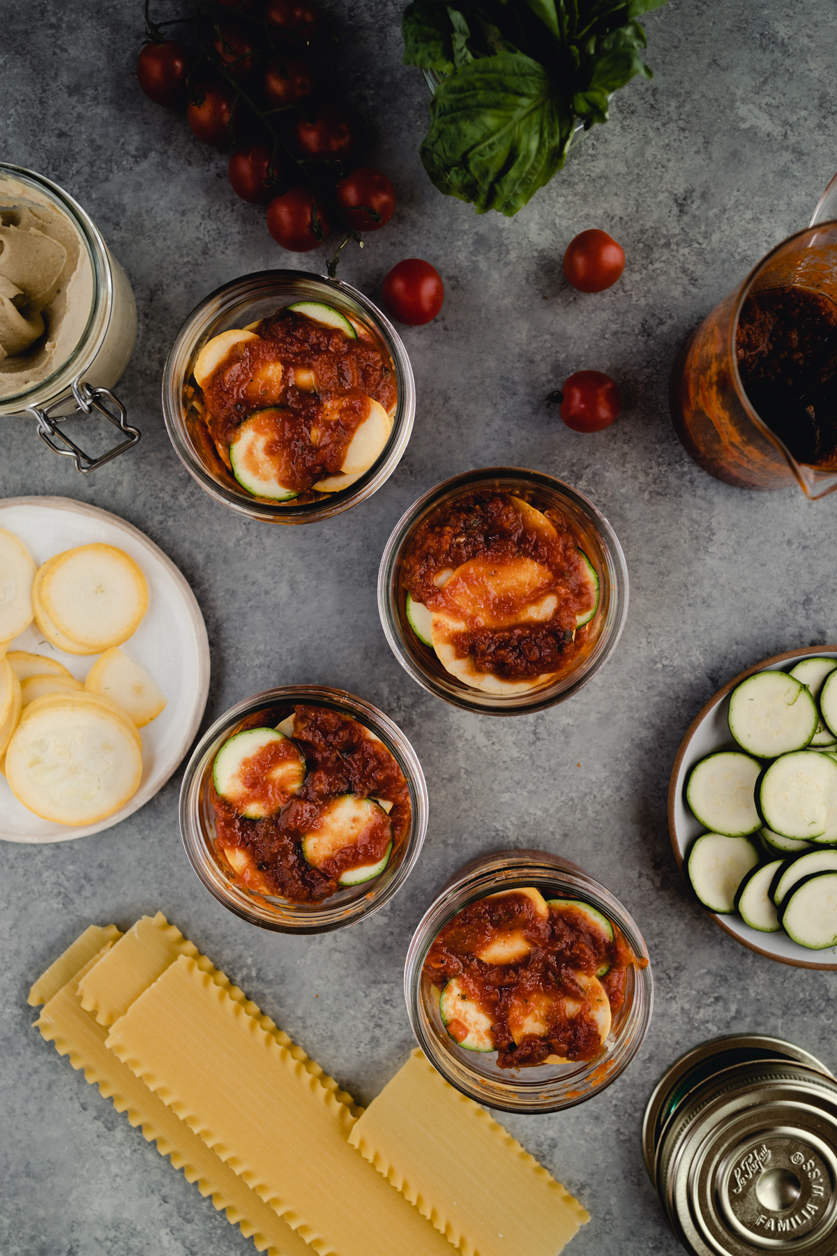 Step-by-step-photo of homemade mini lasagna made in a jar.