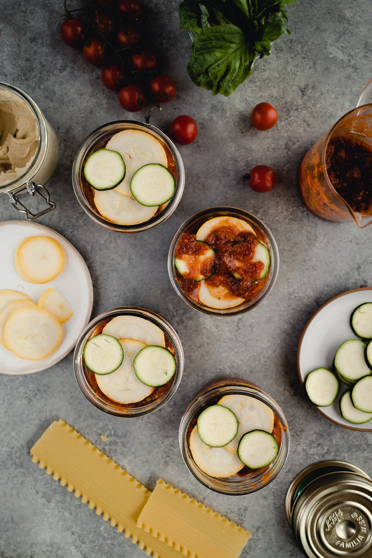 Step-by-step-photo of homemade mini lasagna made in a jar.