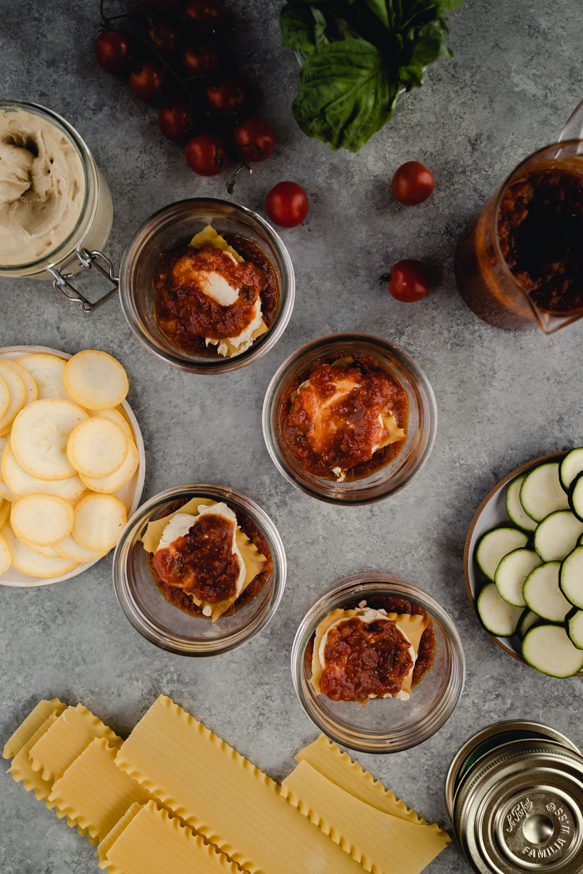 Step-by-step-photo of homemade mini lasagna made in a jar.