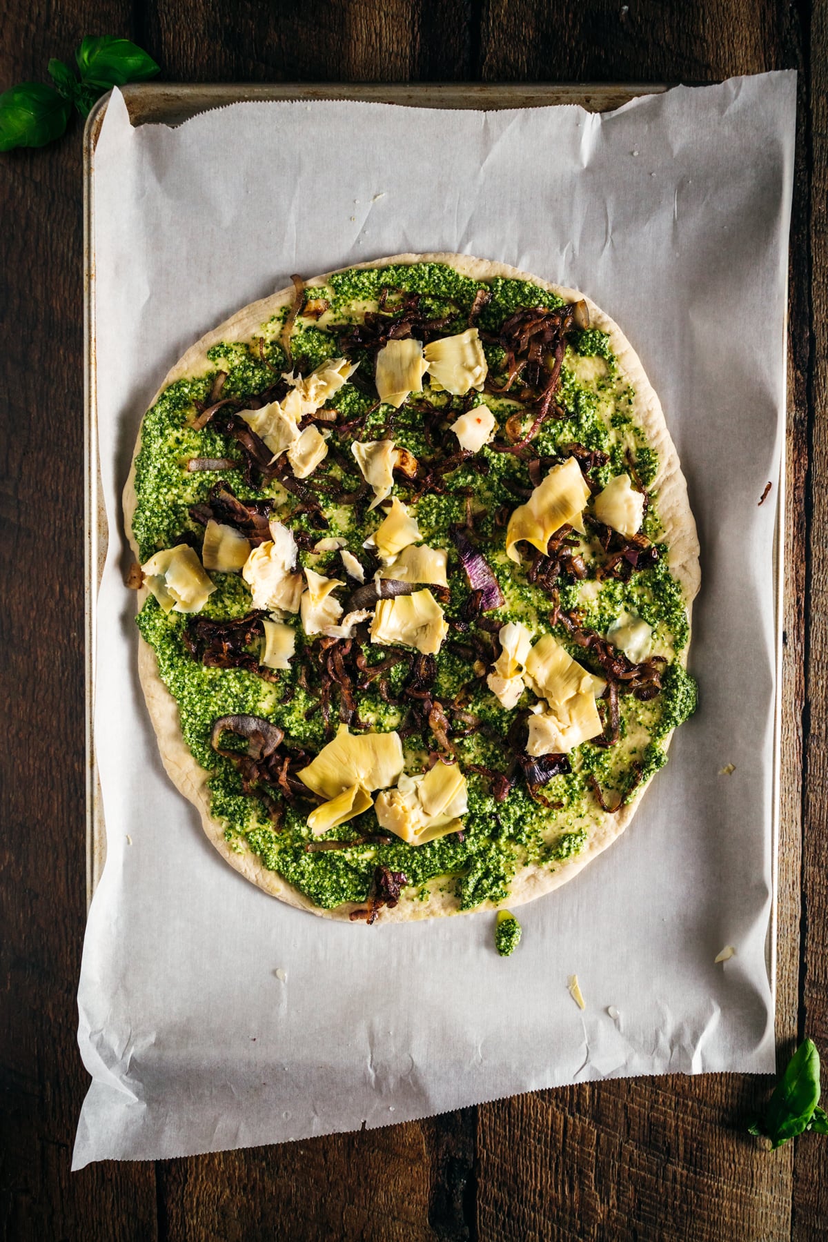 A pizza is sitting on top of a piece of paper.