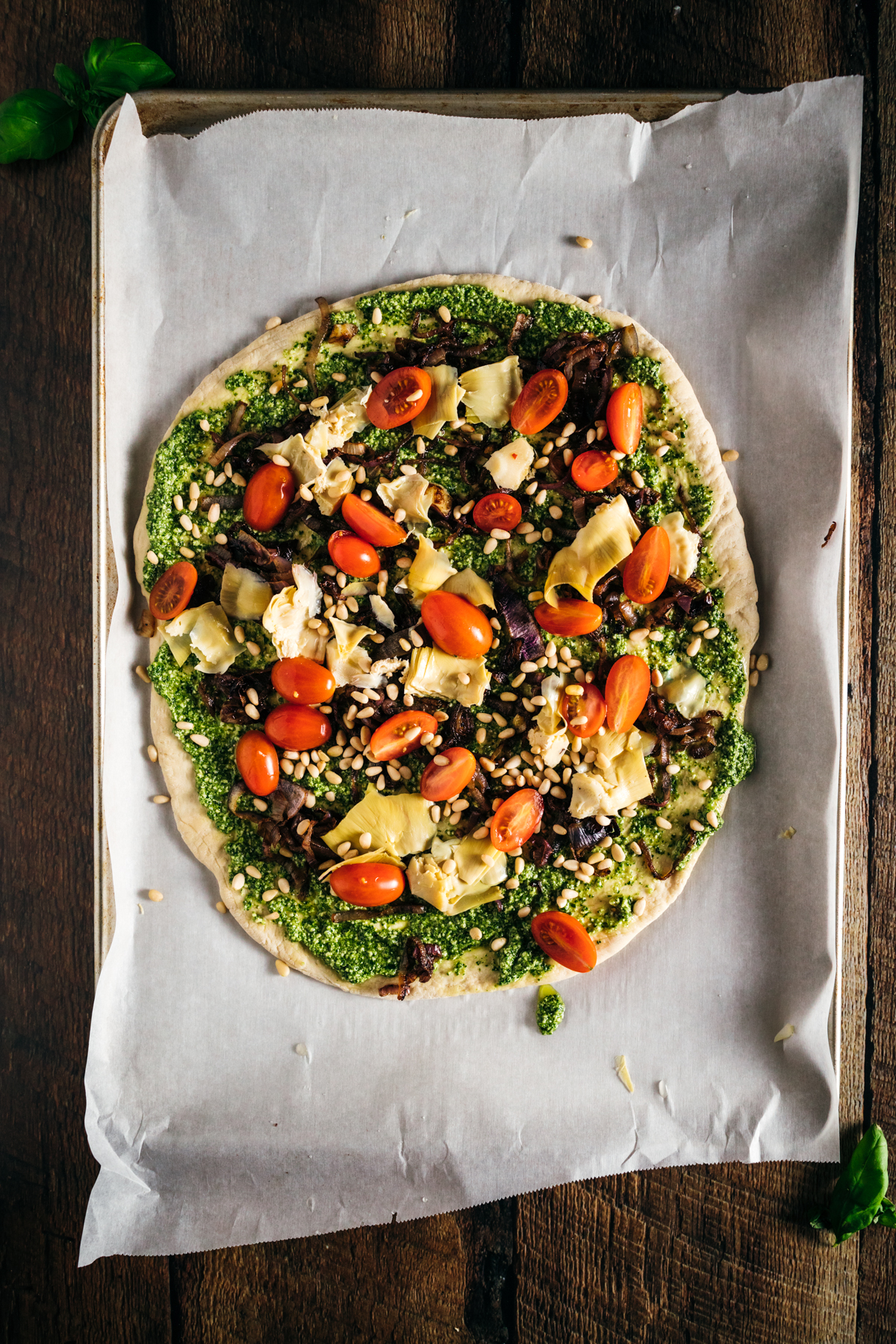 A pizza is sitting on top of a piece of paper.