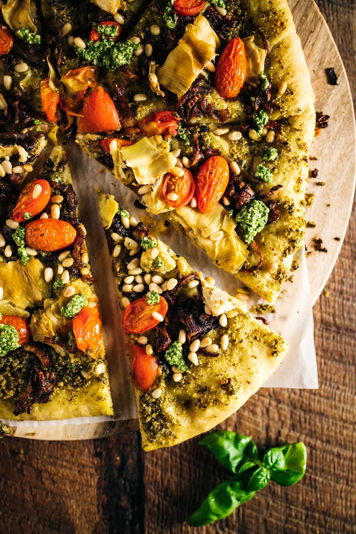 A pizza with a slice taken out of it.