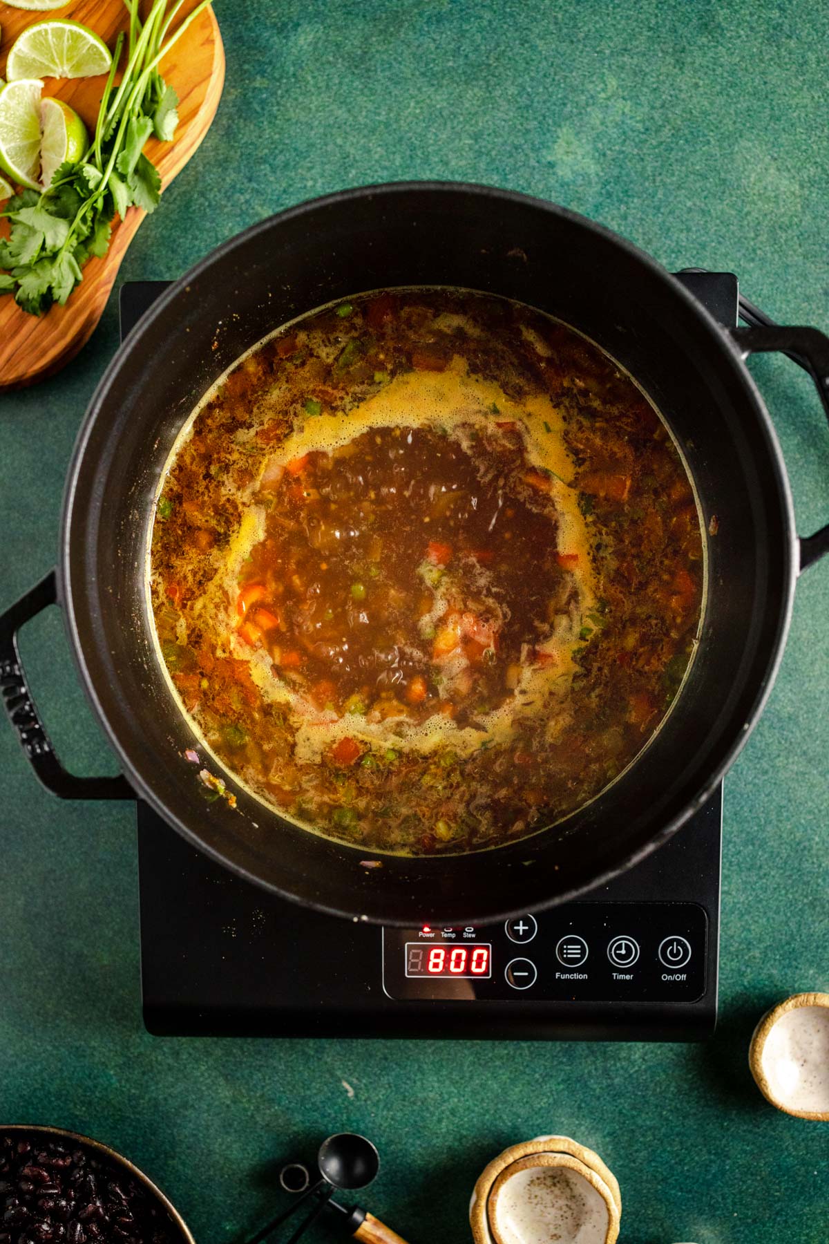 A pot of soup on a stove.