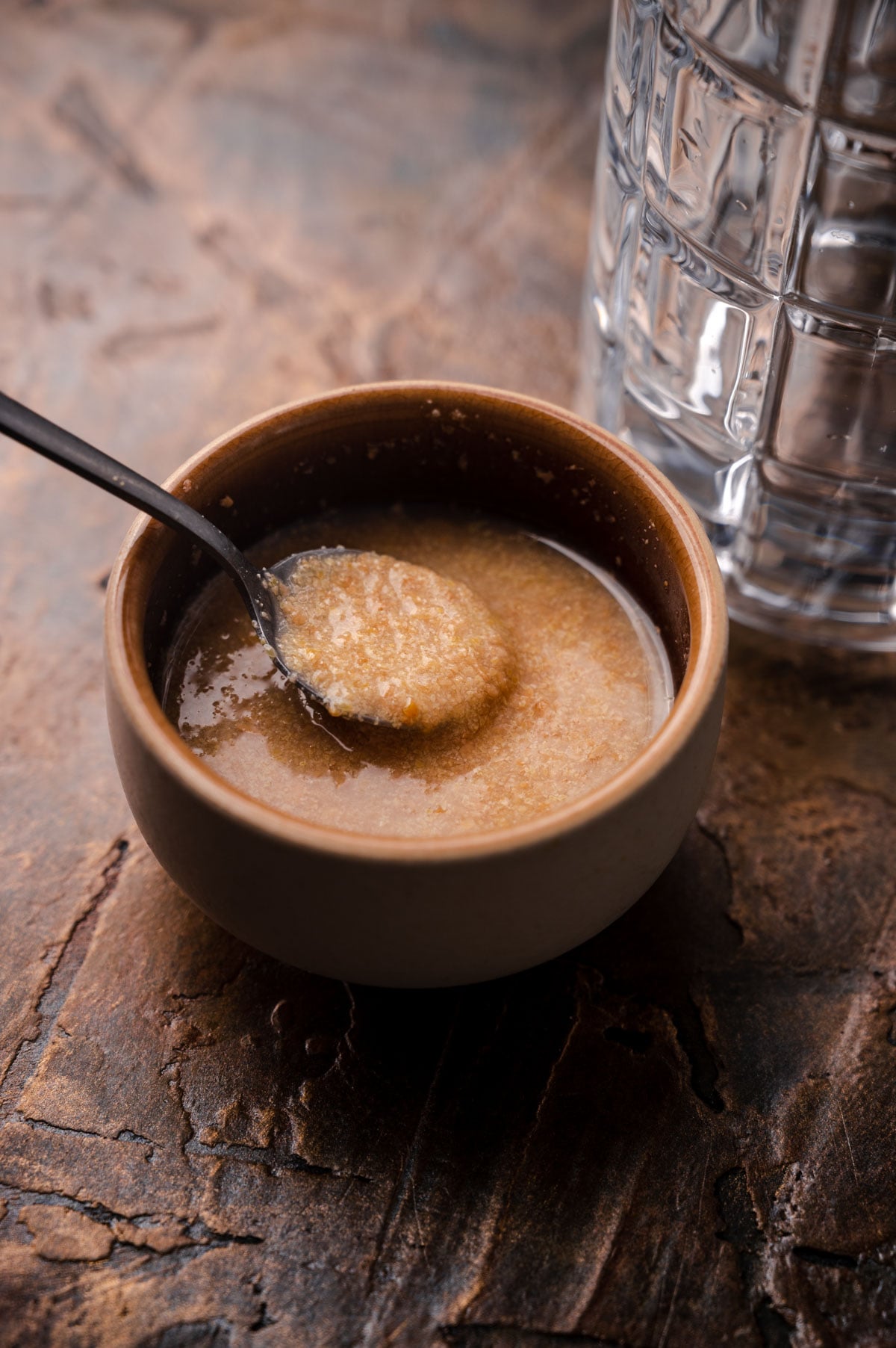 Simple flax egg in a tan bowl.