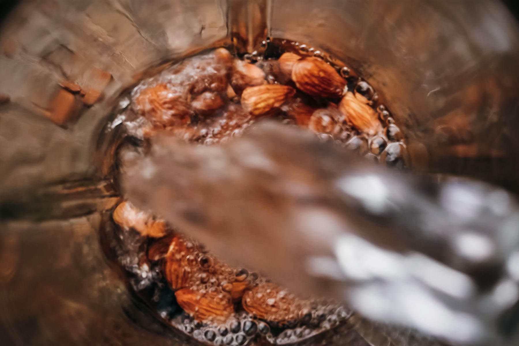 Step-by-step ingredients for making almond milk at home.