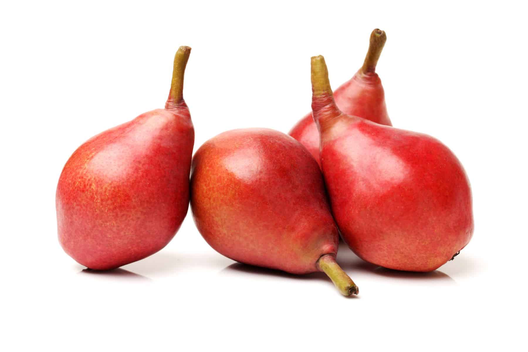 Four red pears with stems arranged against a white background.
