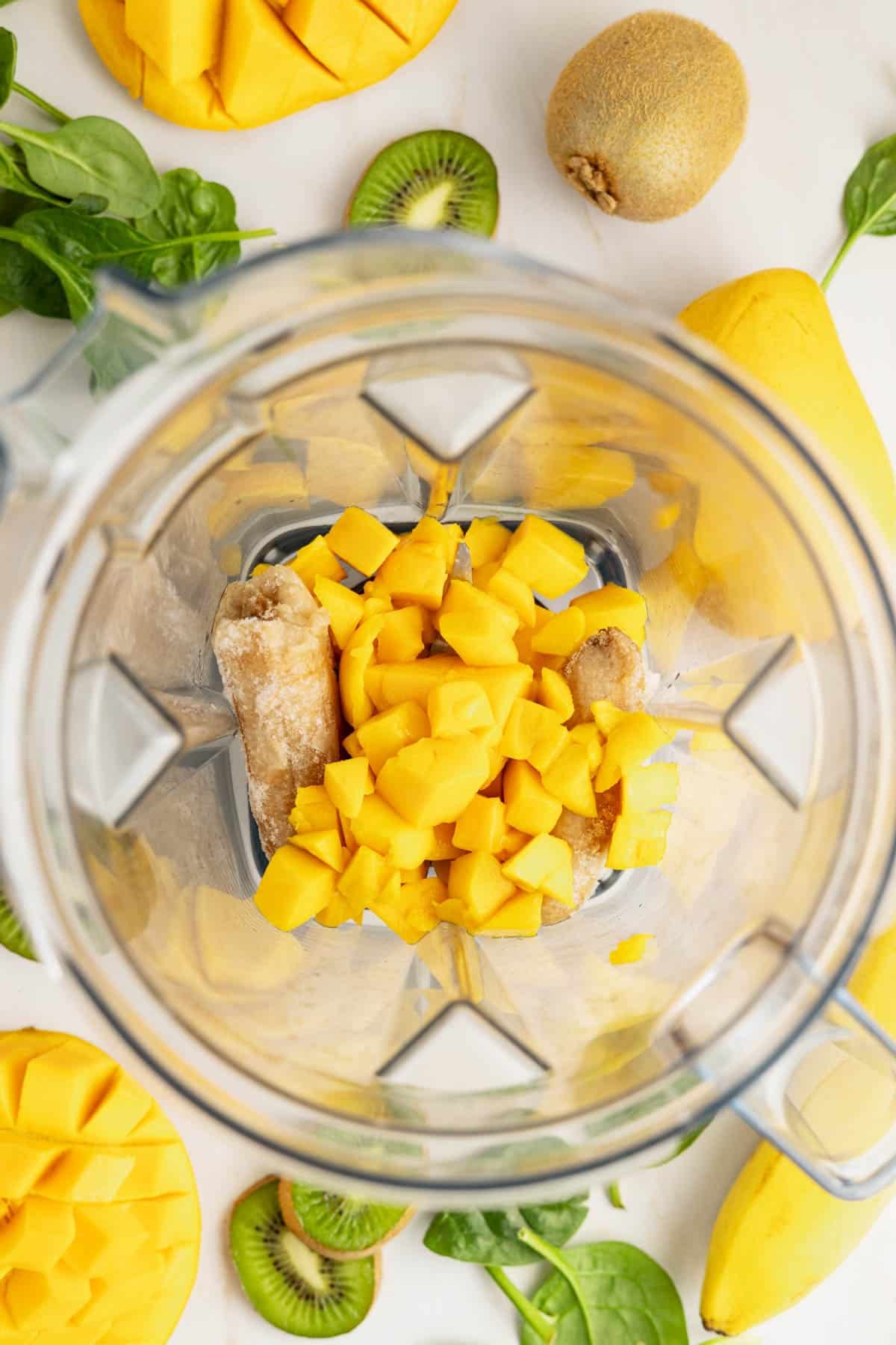 Frozen mango chunks in blender.