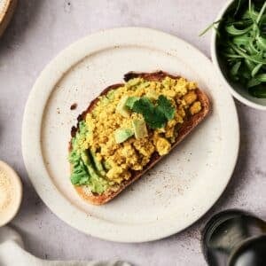 Avocado toast with vegan tofu scramble on top.
