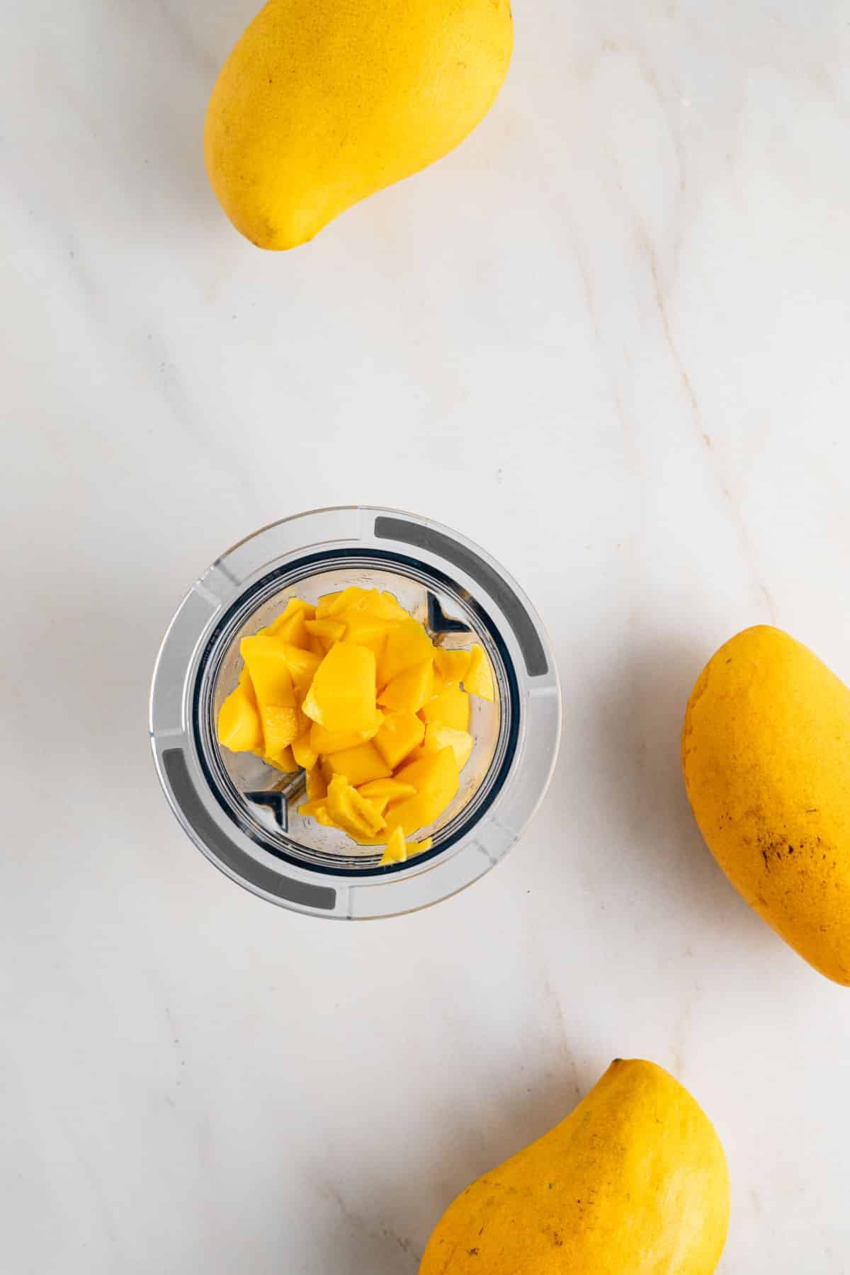 Mango chunks in small blender cup to puree it.