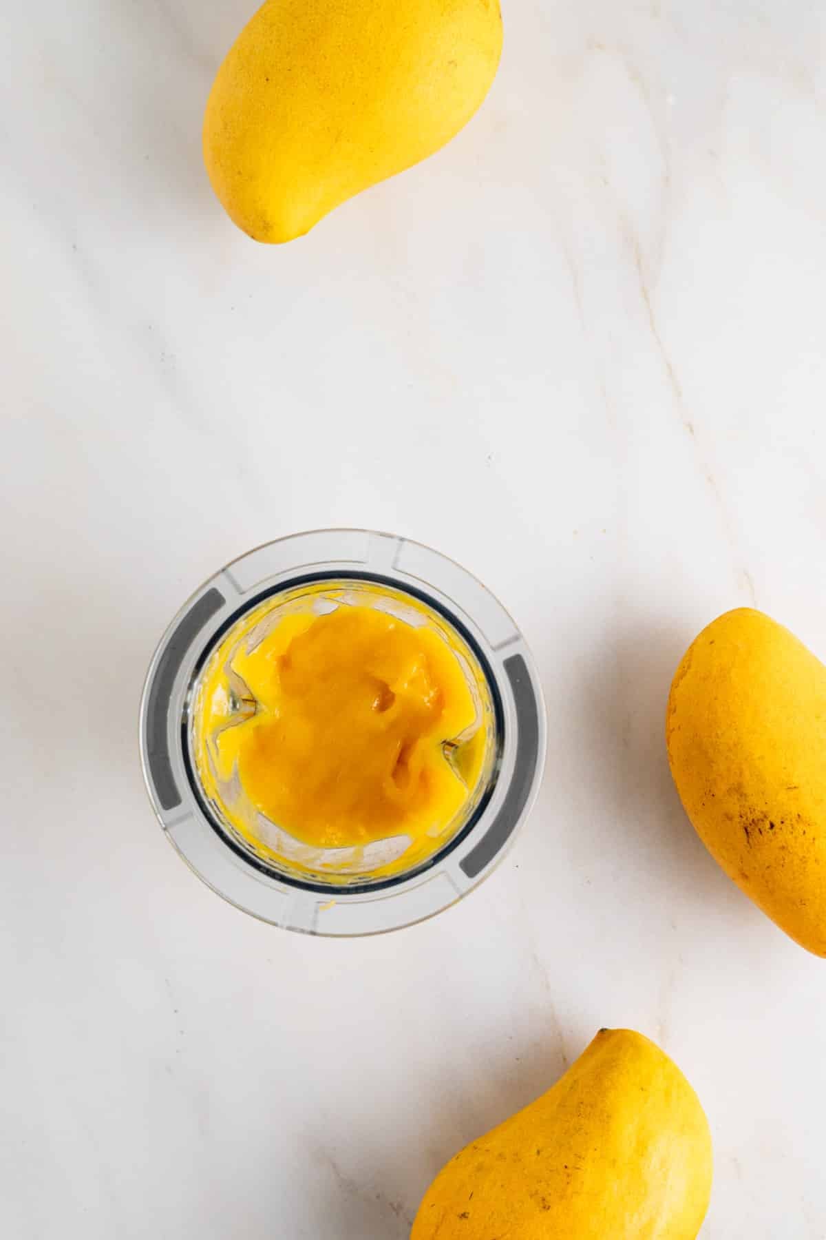 Mango in small blender cup to pureed.