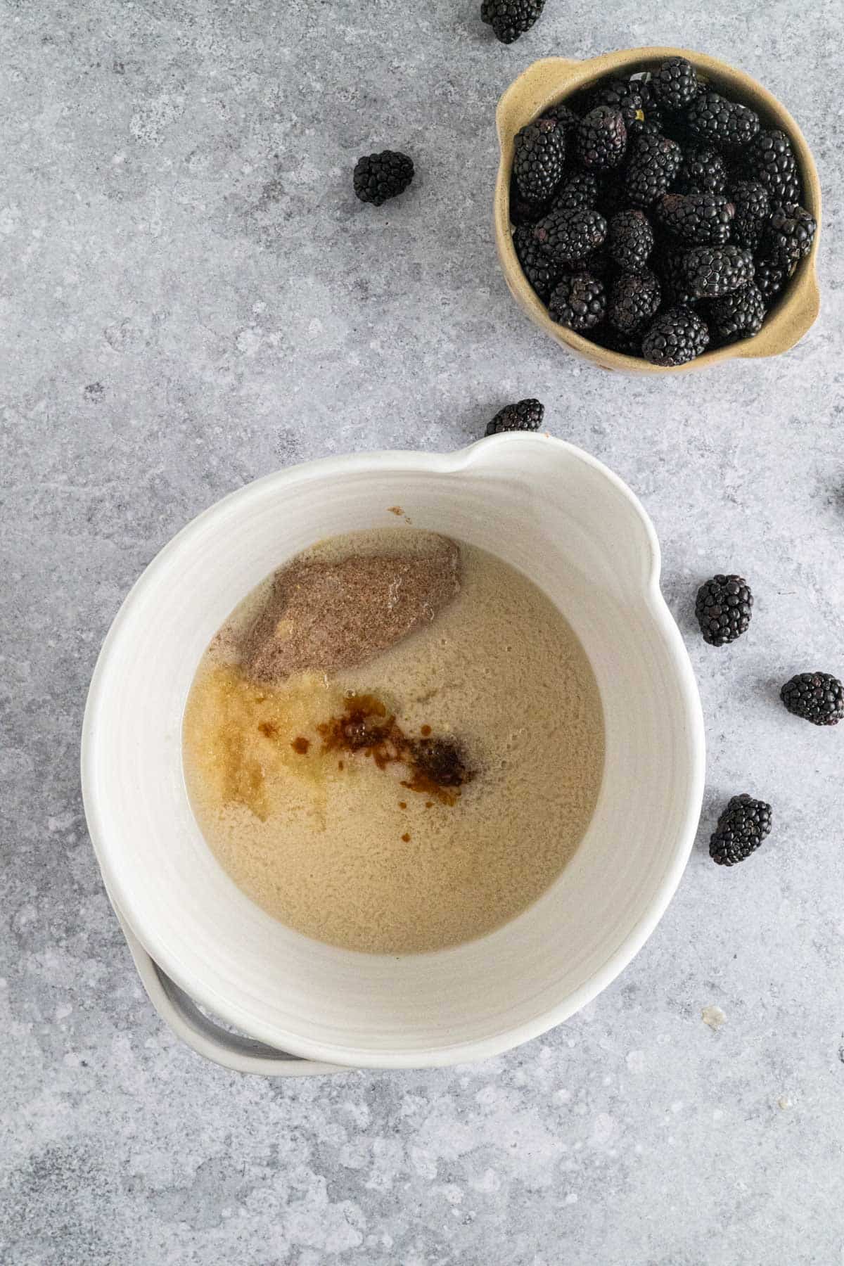 Wet ingredients added into a large mixing bowl.