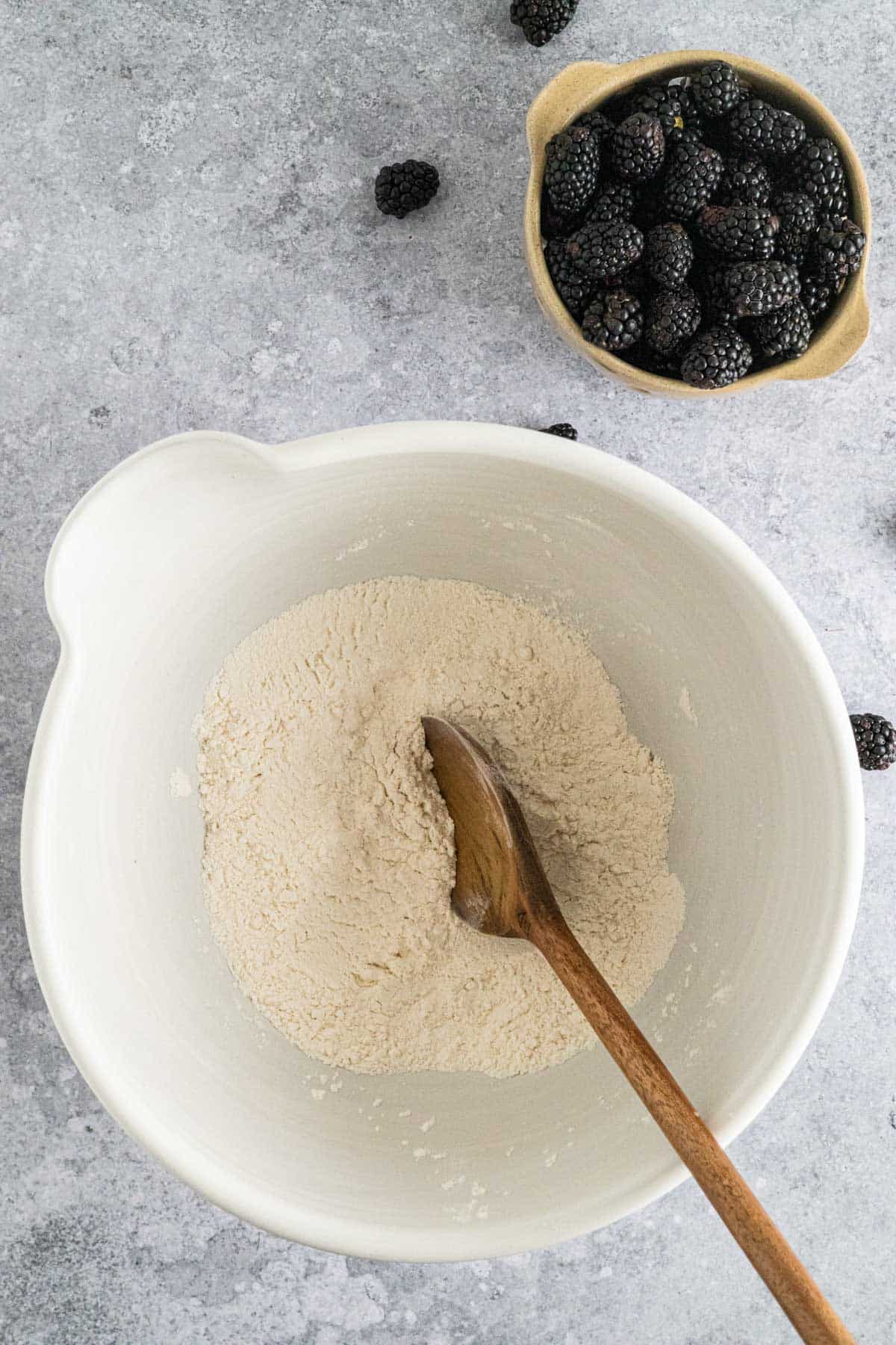 Dry ingredients stirred in a large ceramic mixing bowl.