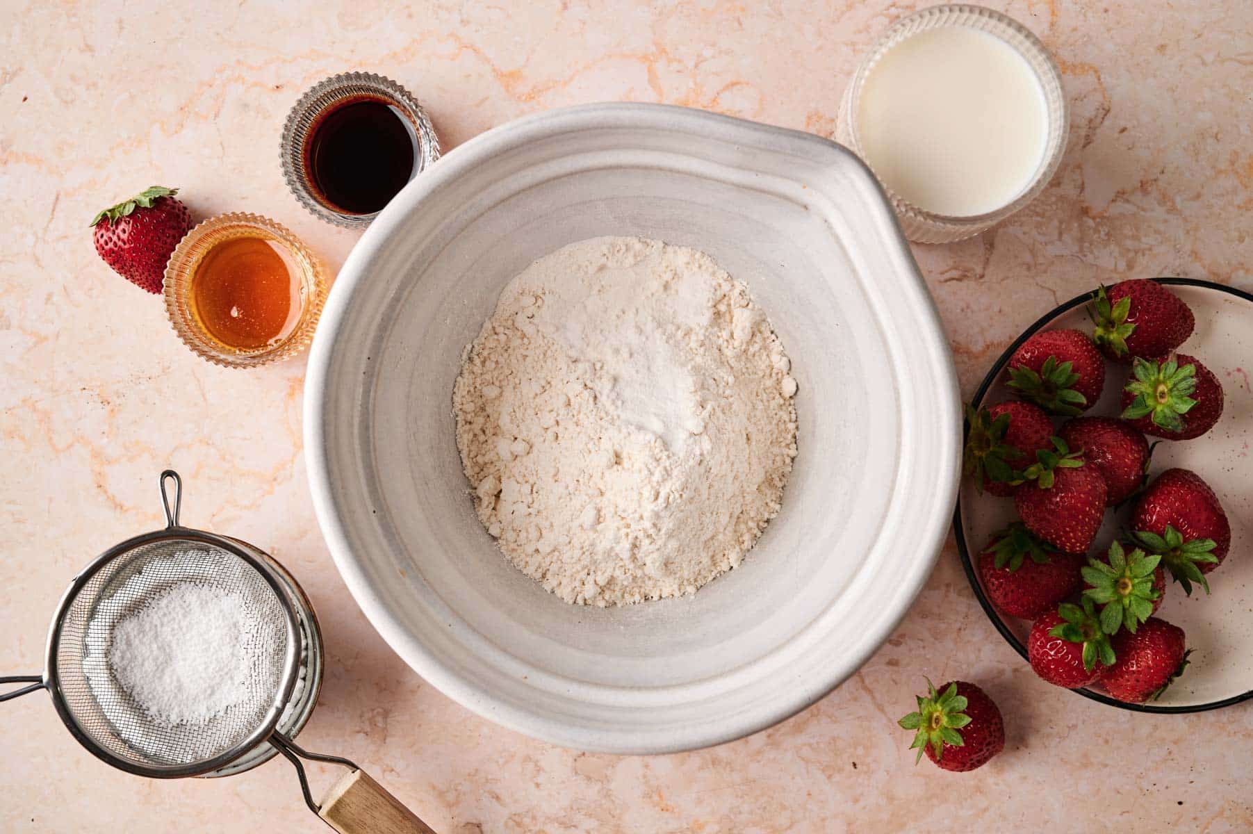 Mixing the ingredients for mini pancakes.