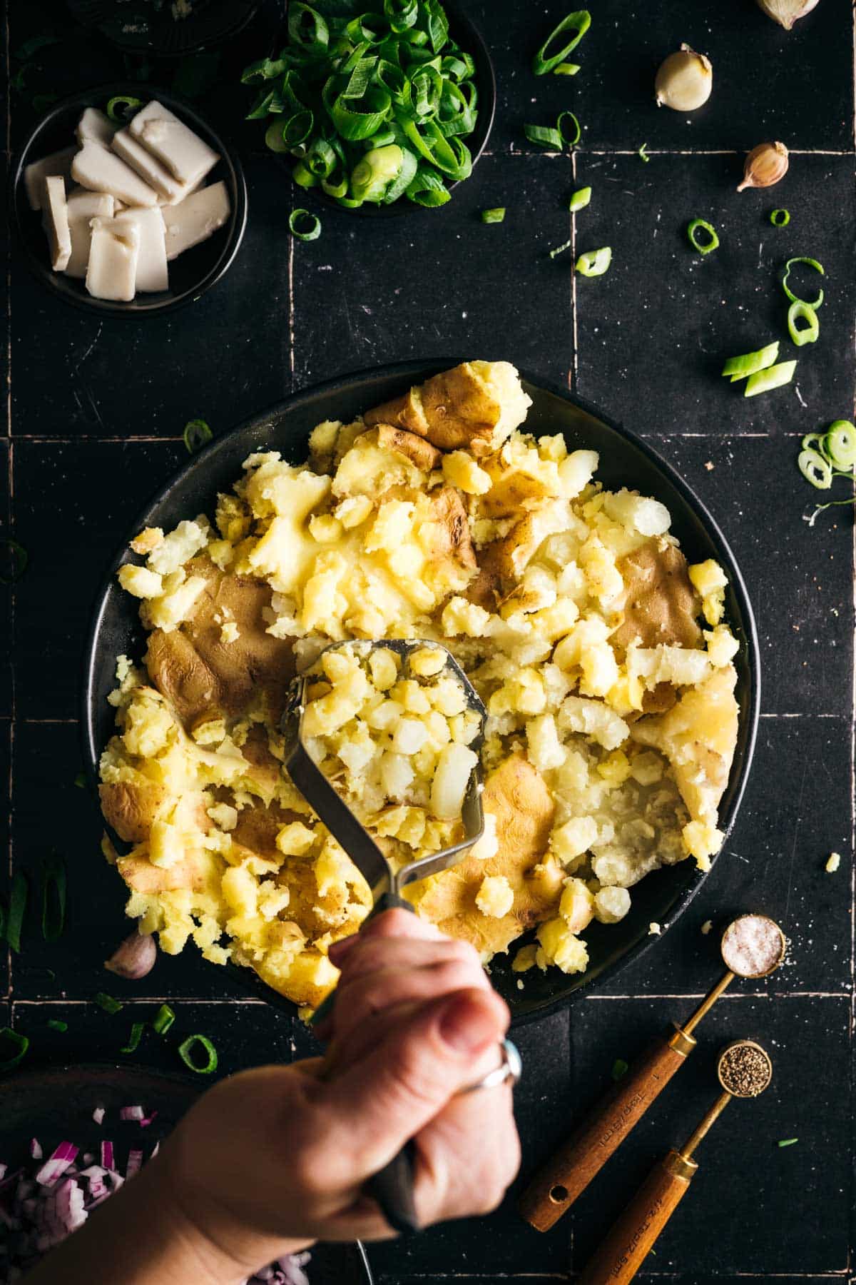 Mashed the cooked potatoes in a shallow bowl.