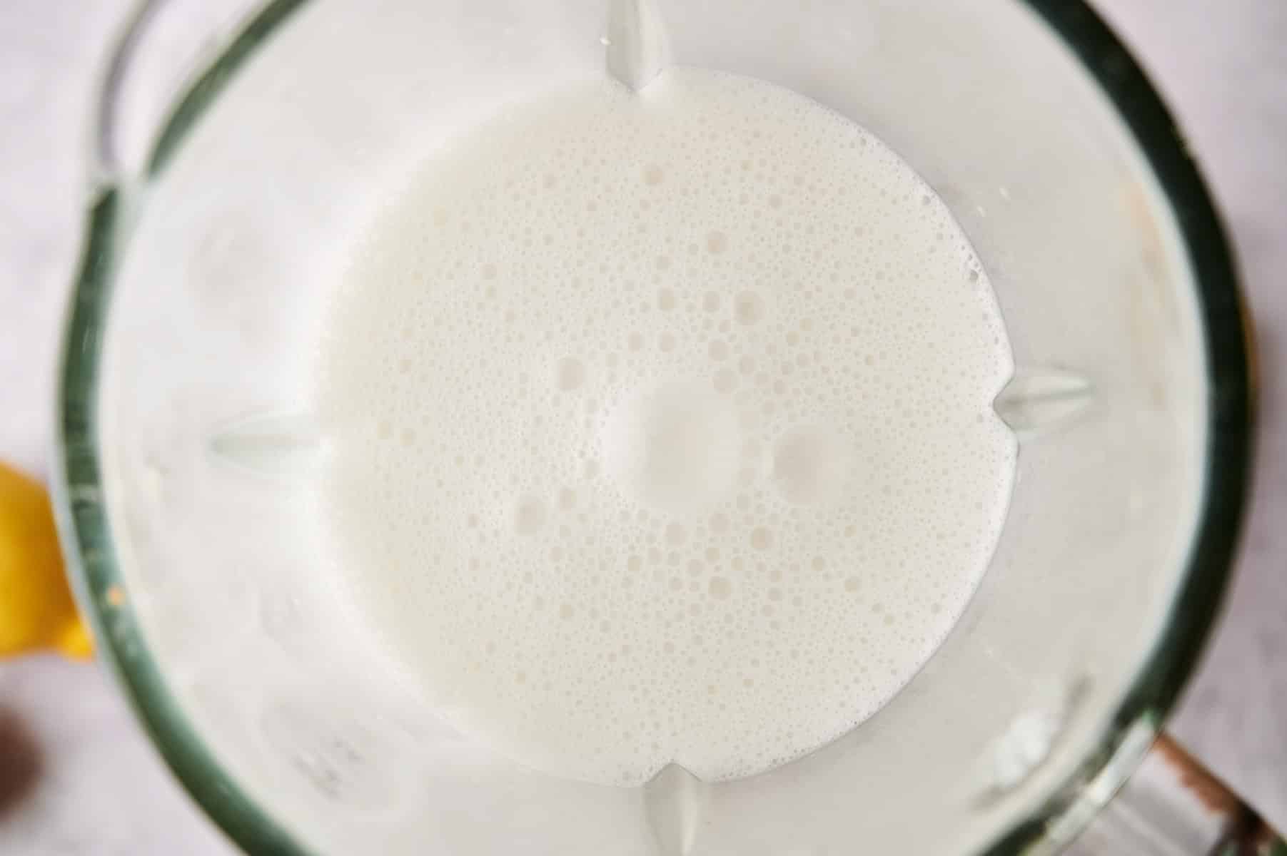 Coconut lemonade in a blender.