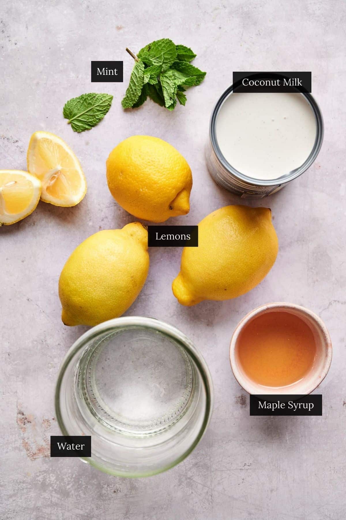 Ingredients for creamy Brazilian coconut lemonade recipe labeled.