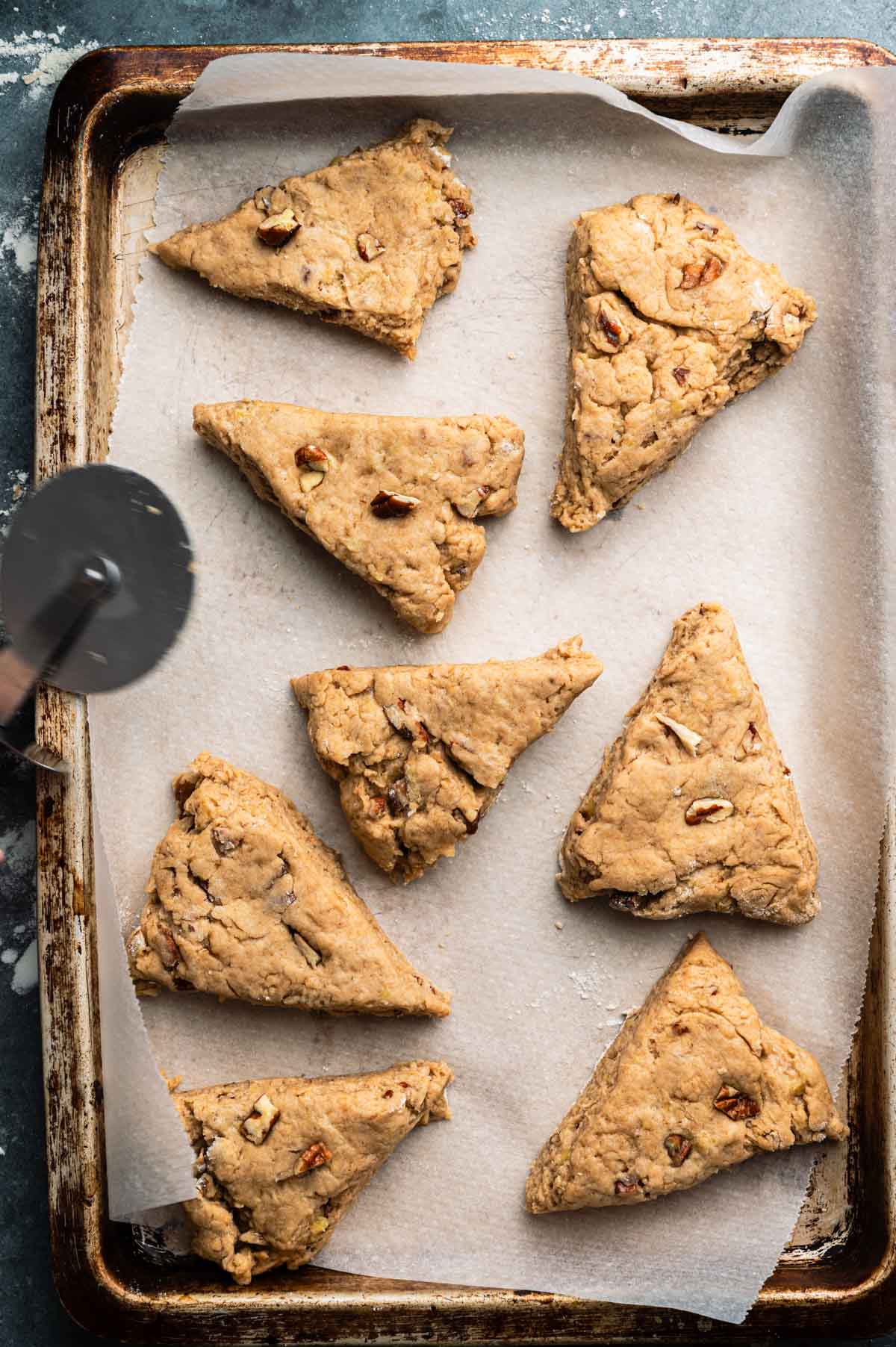 Laying out the dairy free banana scones on a baking tray.