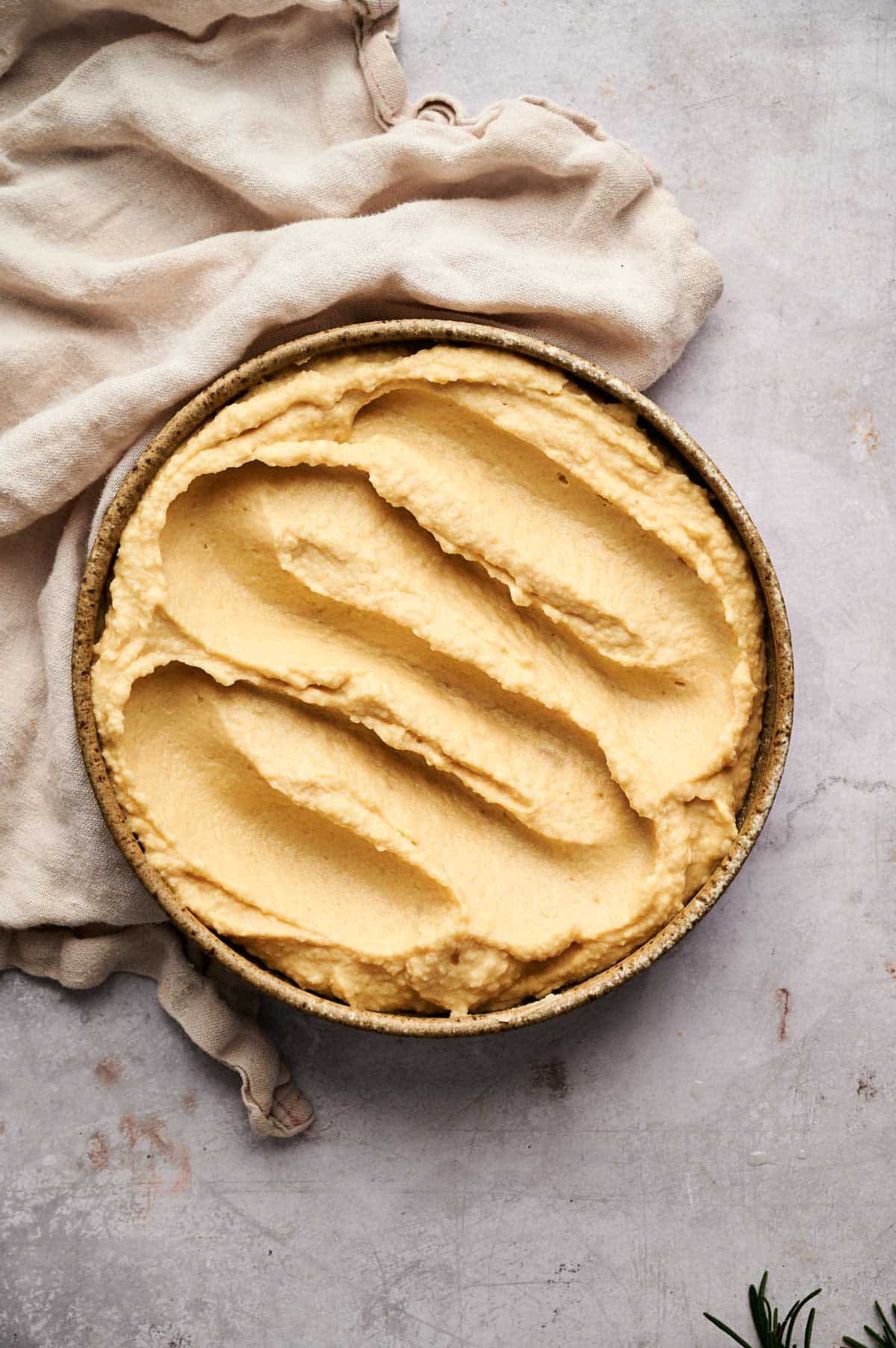 Hummus in a shallow bowl.