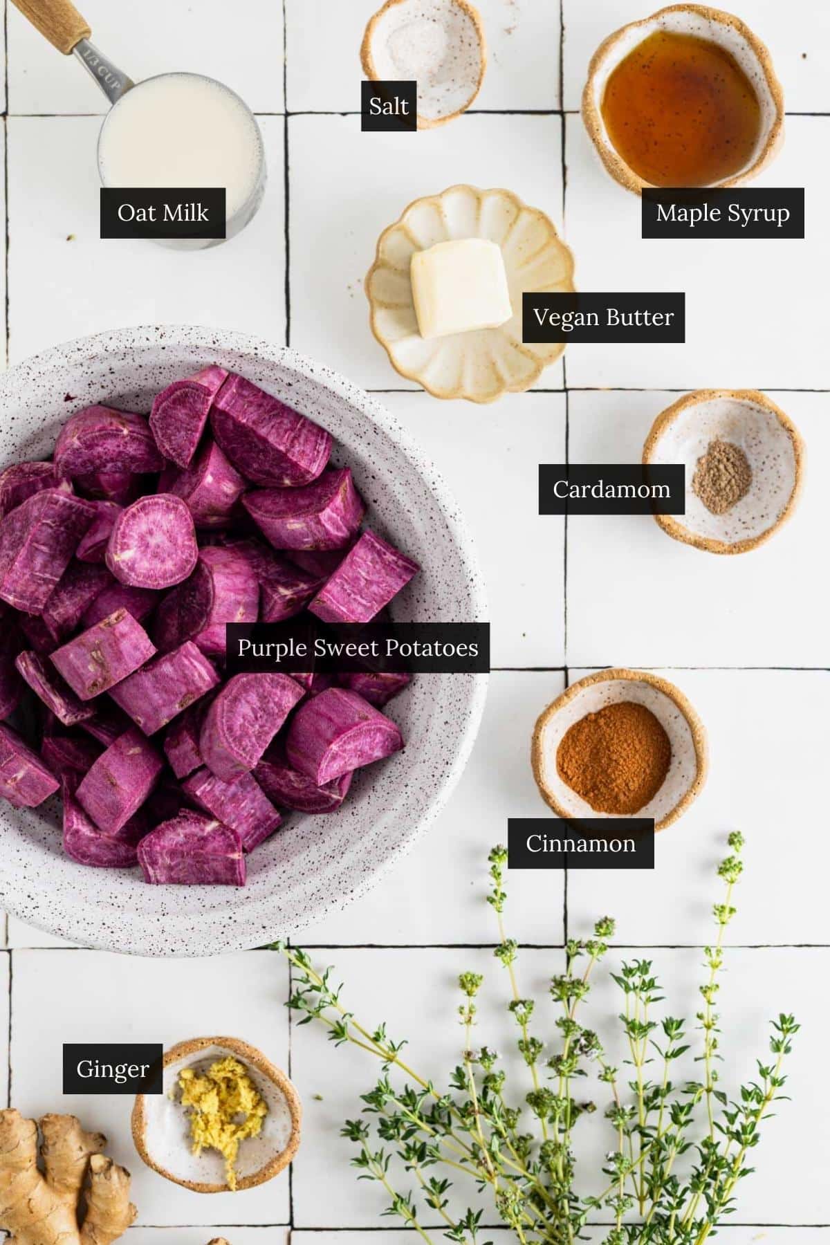 Ingredients for whipped sweet potatoes on a white tile counter with each ingredient labeled.