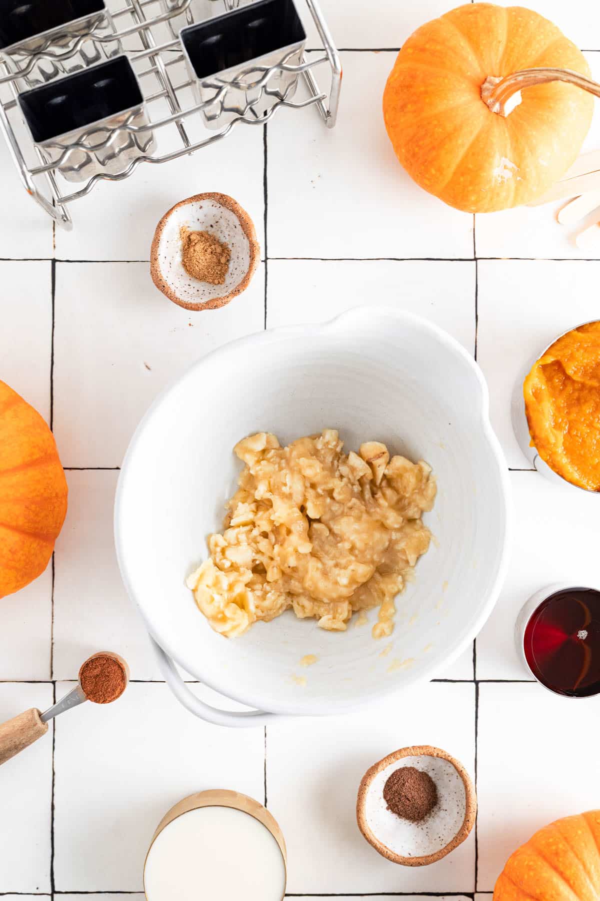 Banana added to a bowl and mashed.