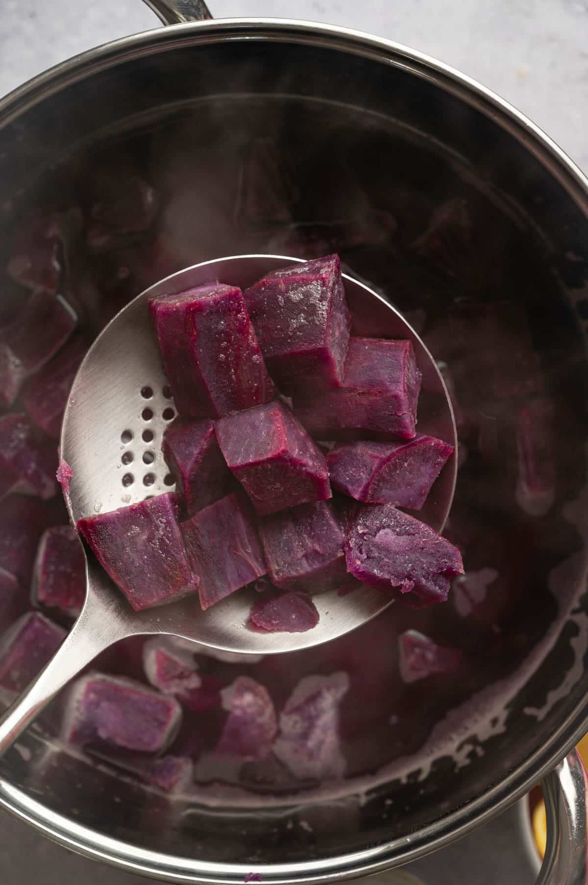Boiling sweet potatoes for sweet potato pie.