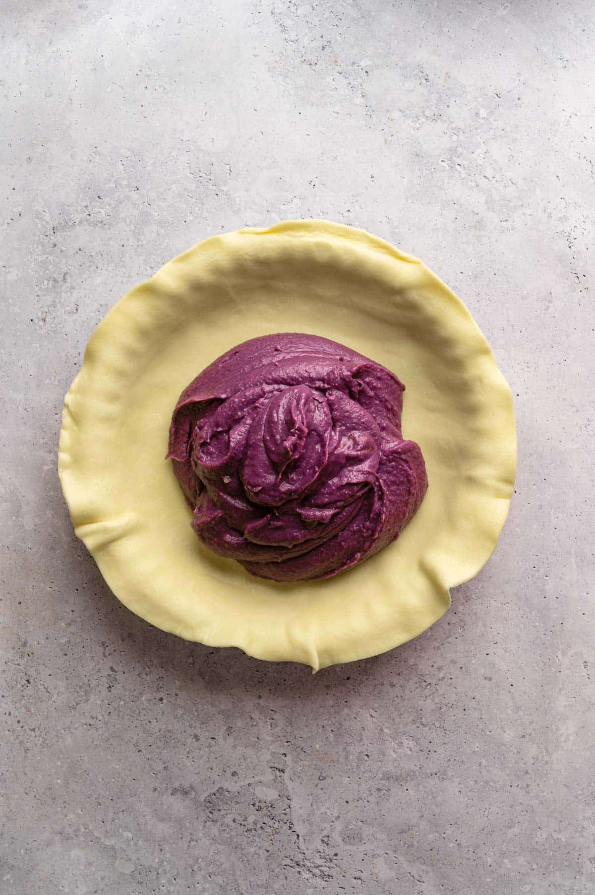 Sweet potato pie filling in the pie crust.